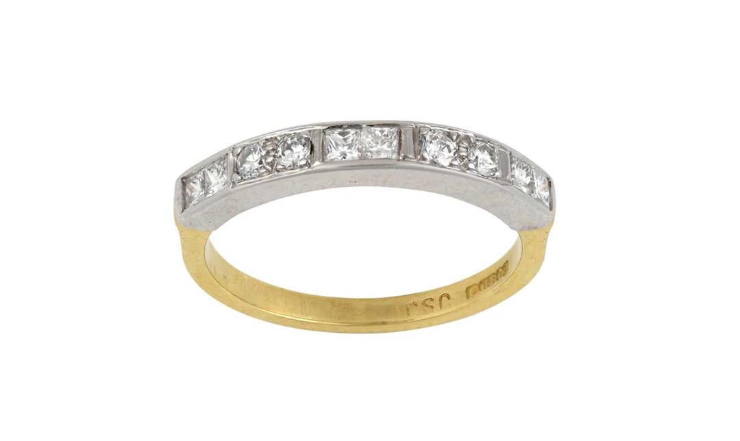An 18 Carat Gold Diamond Half Hoop Ring