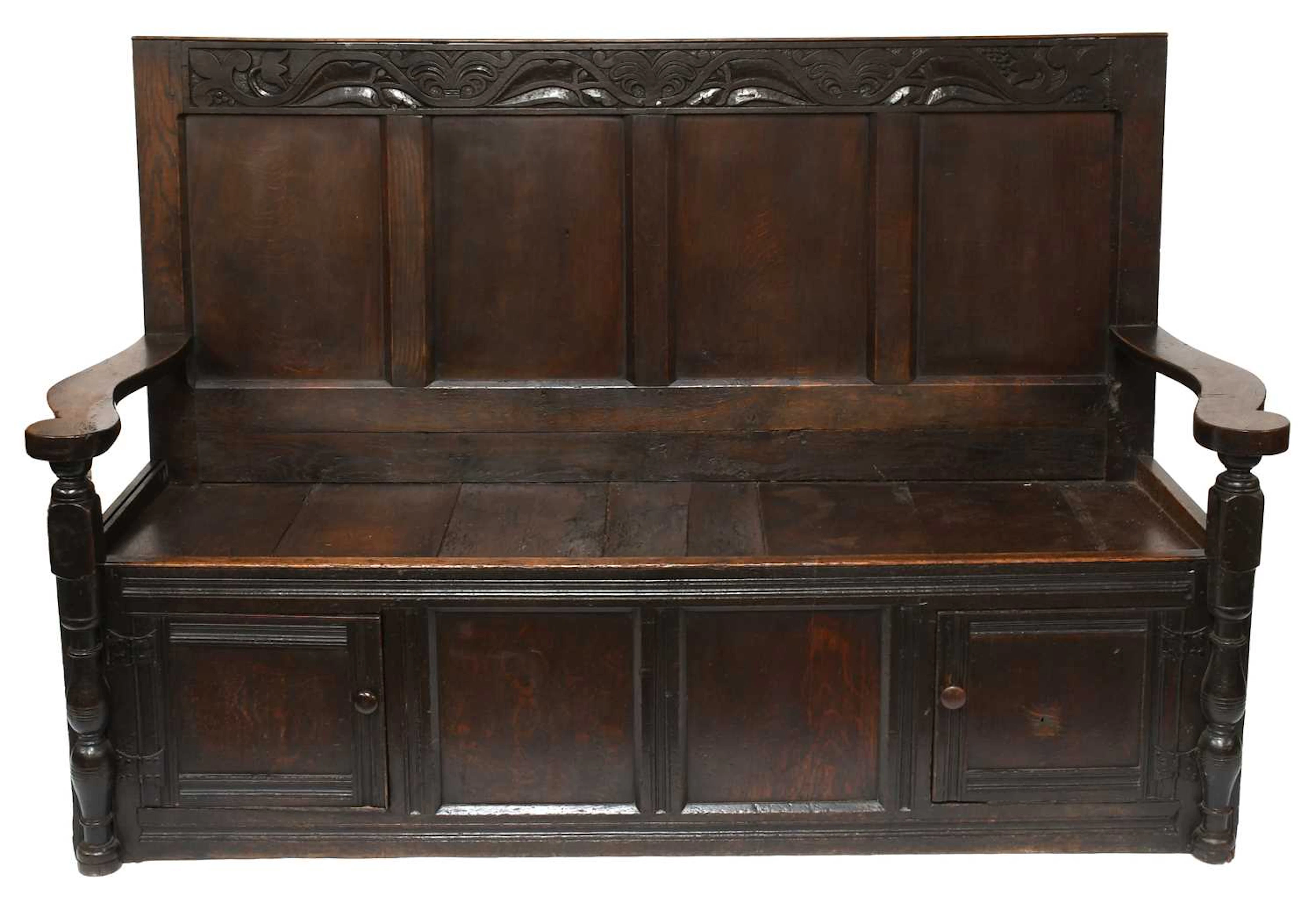 An Oak Four Panel Settle, late 18th/early 19th century