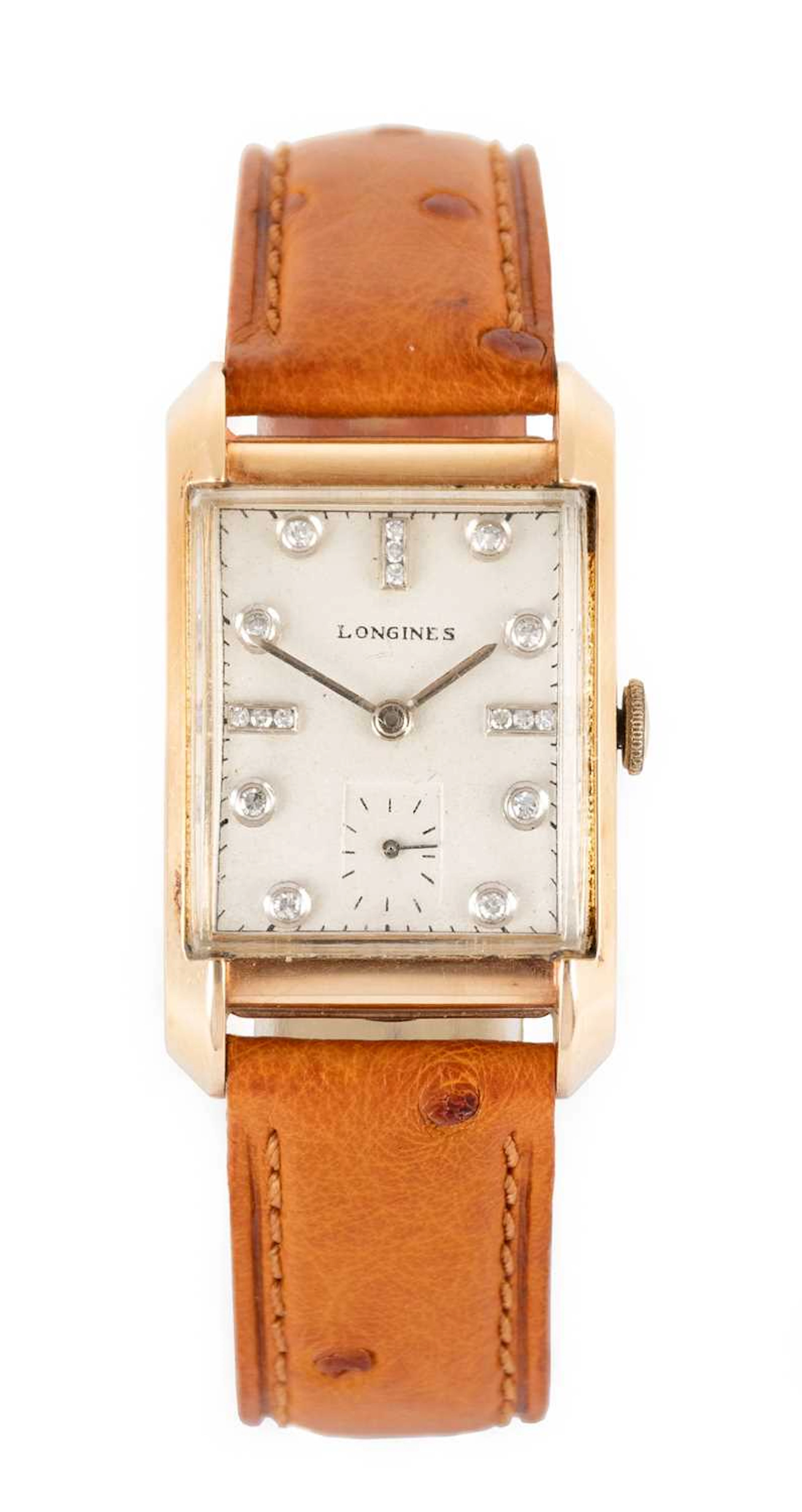 Longines: A 14 Carat Gold Curved Wristwatch with Diamond Set Dial