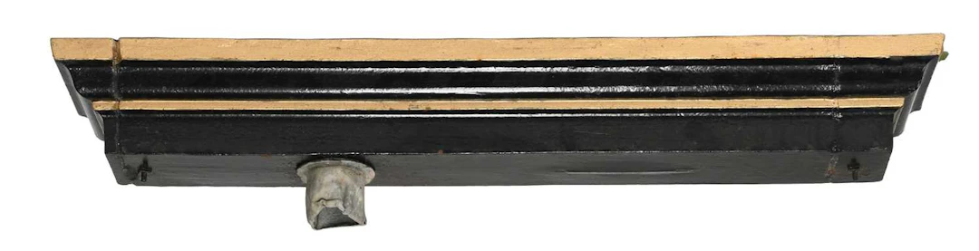 A Long Black and Gilt Painted Cast Iron Hopper, 19th century