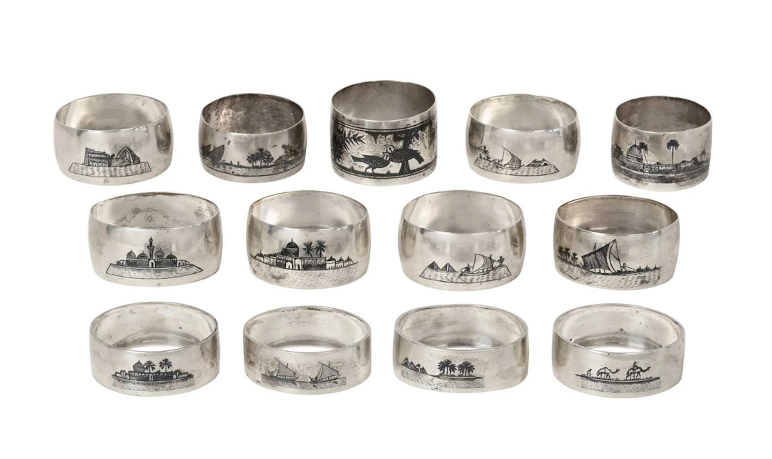 A Collection of Thirteen Various Iraqi Silver and Niello Napkin-Rings
