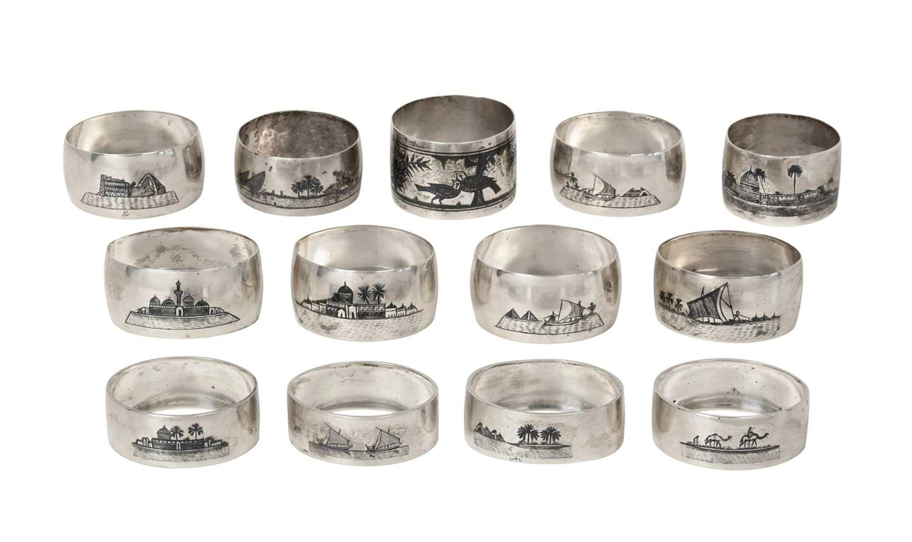 A Collection of Thirteen Various Iraqi Silver and Niello Napkin-Rings