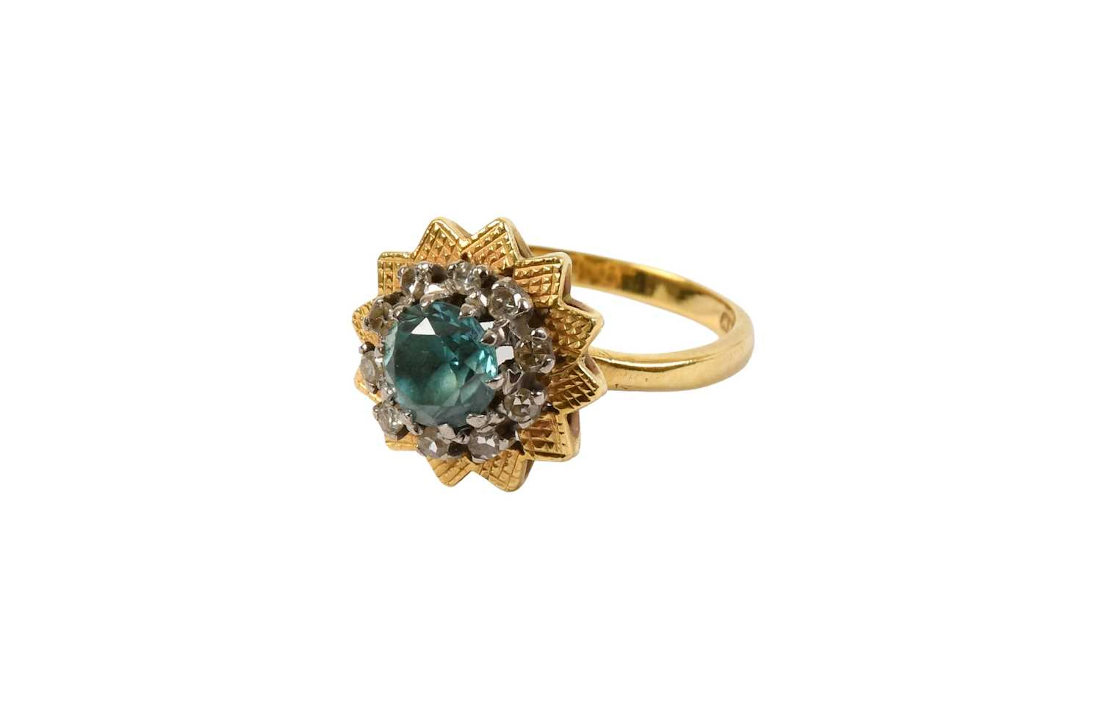 An 18 Carat Gold Blue Zircon and Diamond Cluster Ring