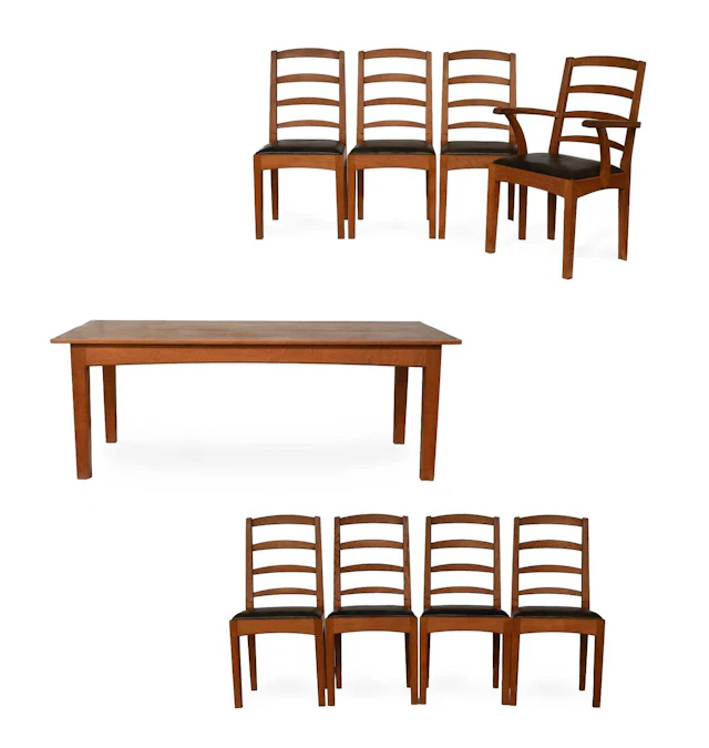 Peter Hall & Son of Staveley: An English Oak Dining Room Suite, A