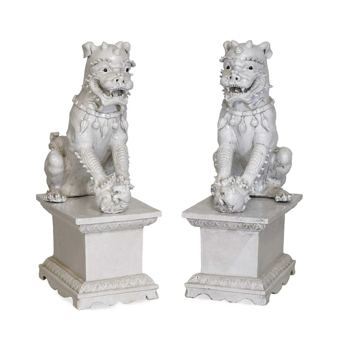 A Pair of Chinese Blanc de Chine Crackle Glaze Buddhistic Lions