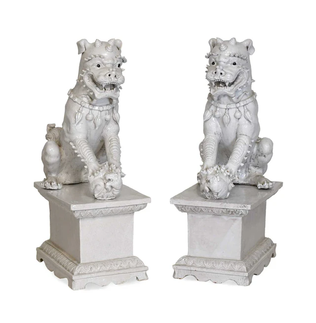 A Pair of Chinese Blanc de Chine Crackle Glaze Buddhistic Lions