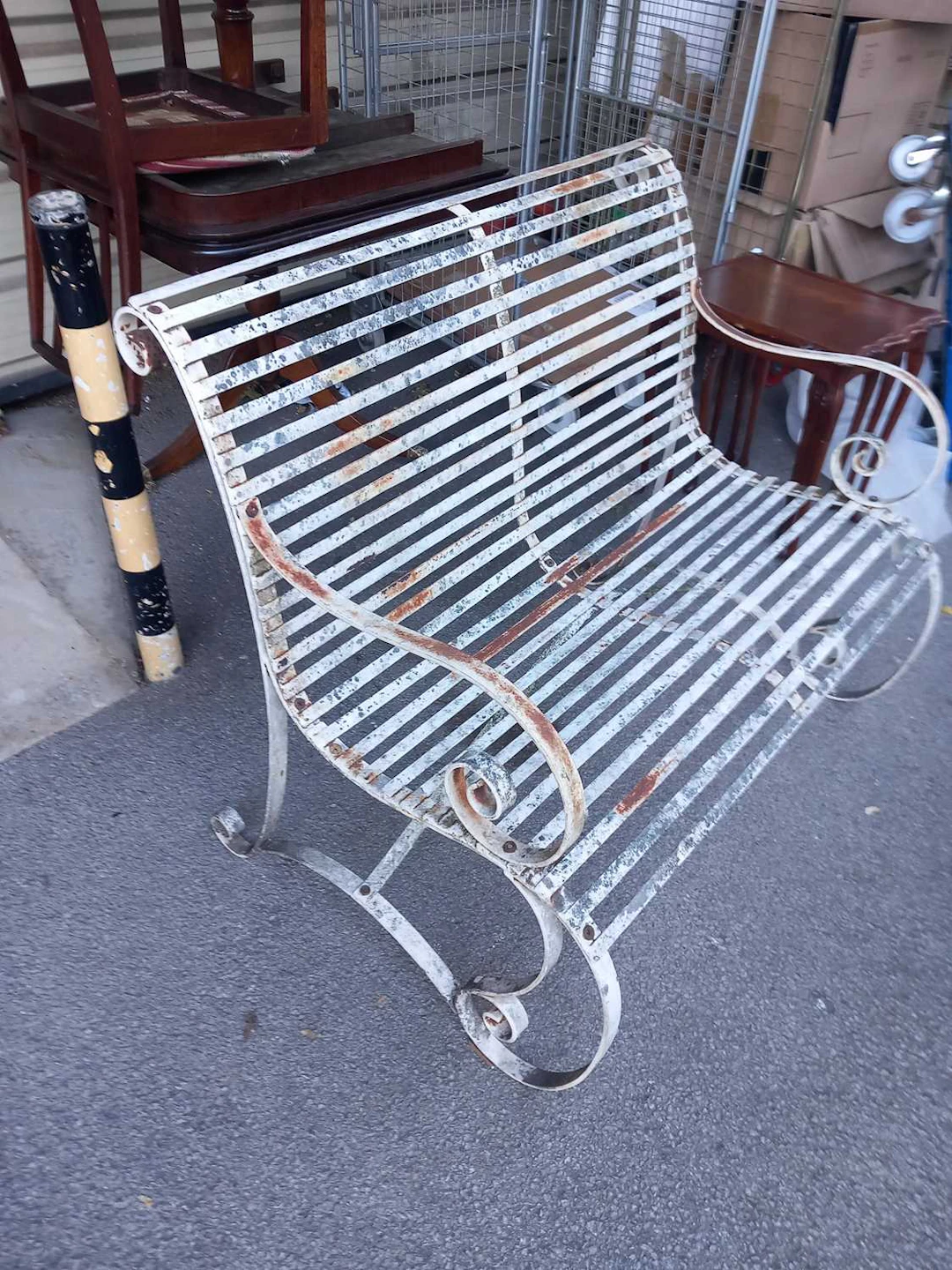 A White Painted Wrought Iron Garden Bench