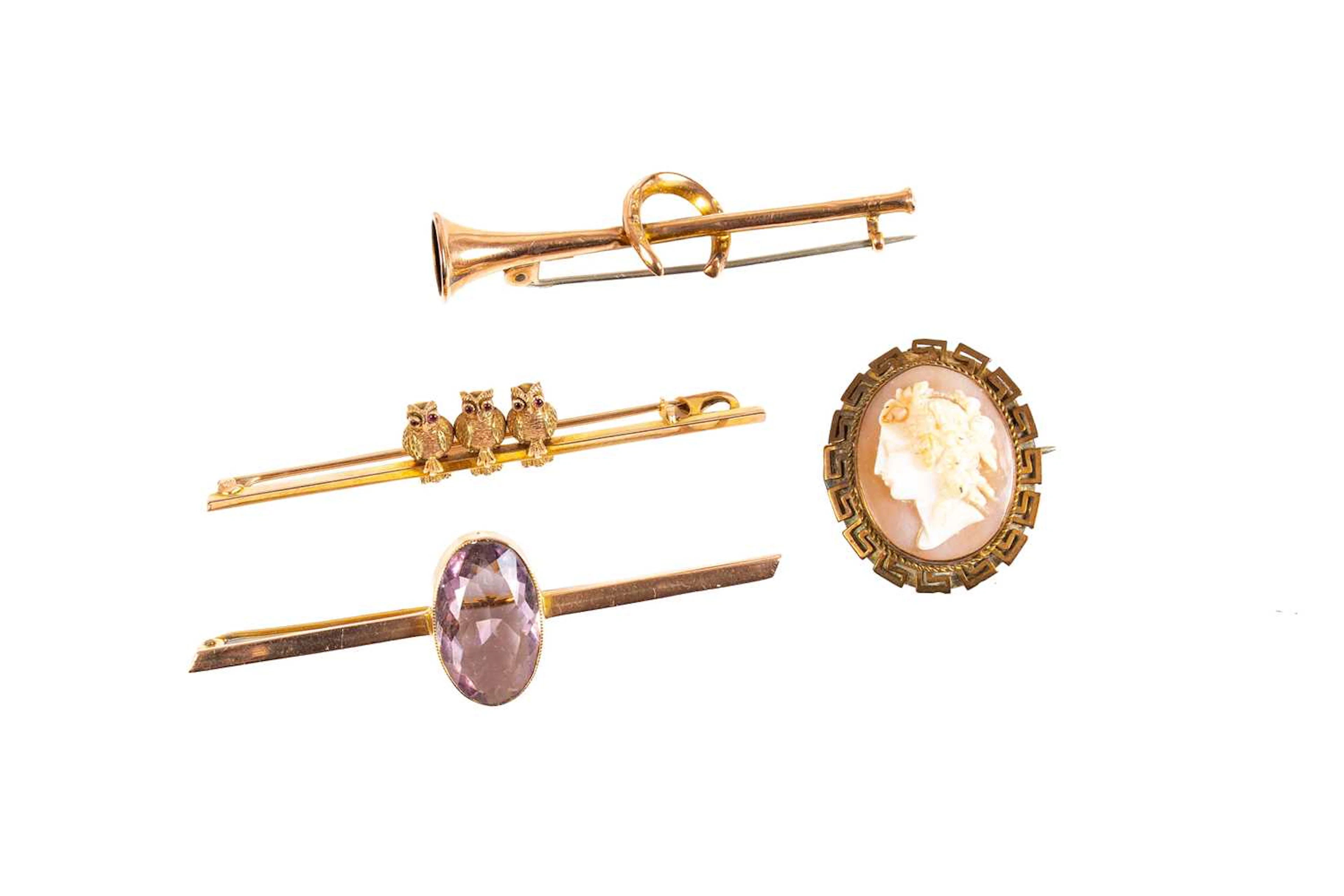 A Hunting Horn Bar Brooch, An Amethyst Bar Brooch, An Owl Bar Brooch