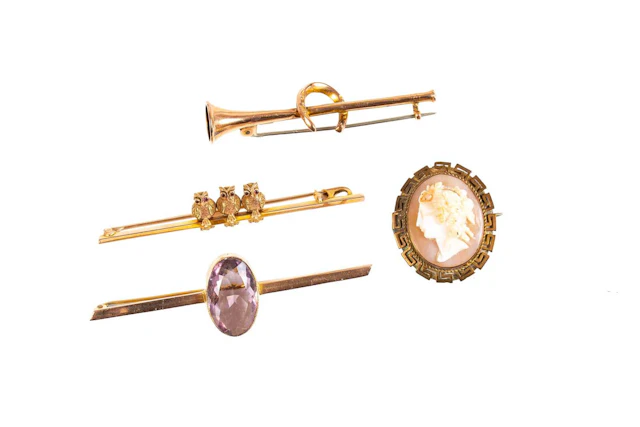 A Hunting Horn Bar Brooch, An Amethyst Bar Brooch, An Owl Bar Brooch