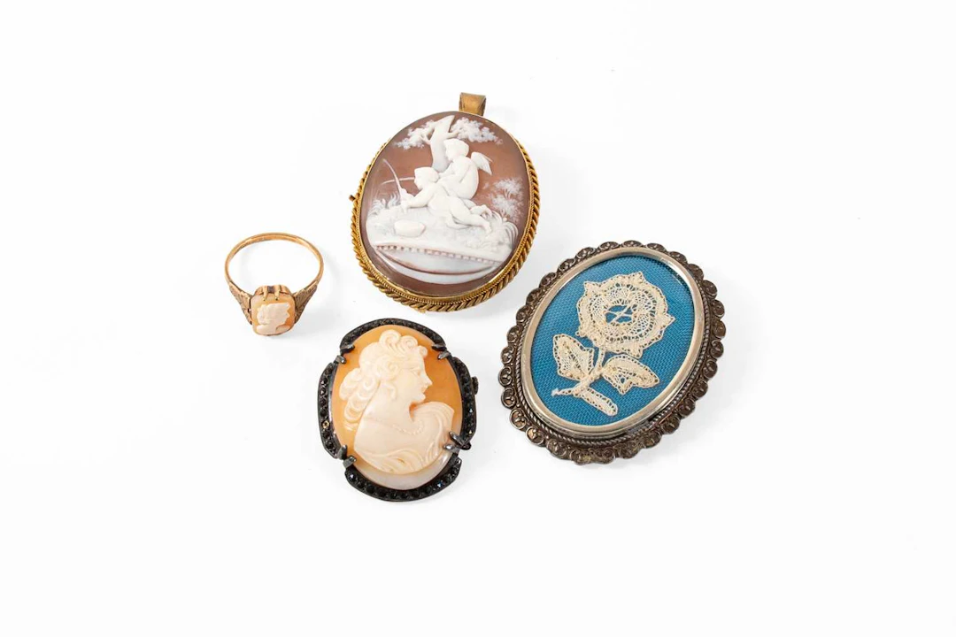 A Cameo Ring, A Cameo Brooch/Pendant, Another Cameo Brooch, A Lace Brooch