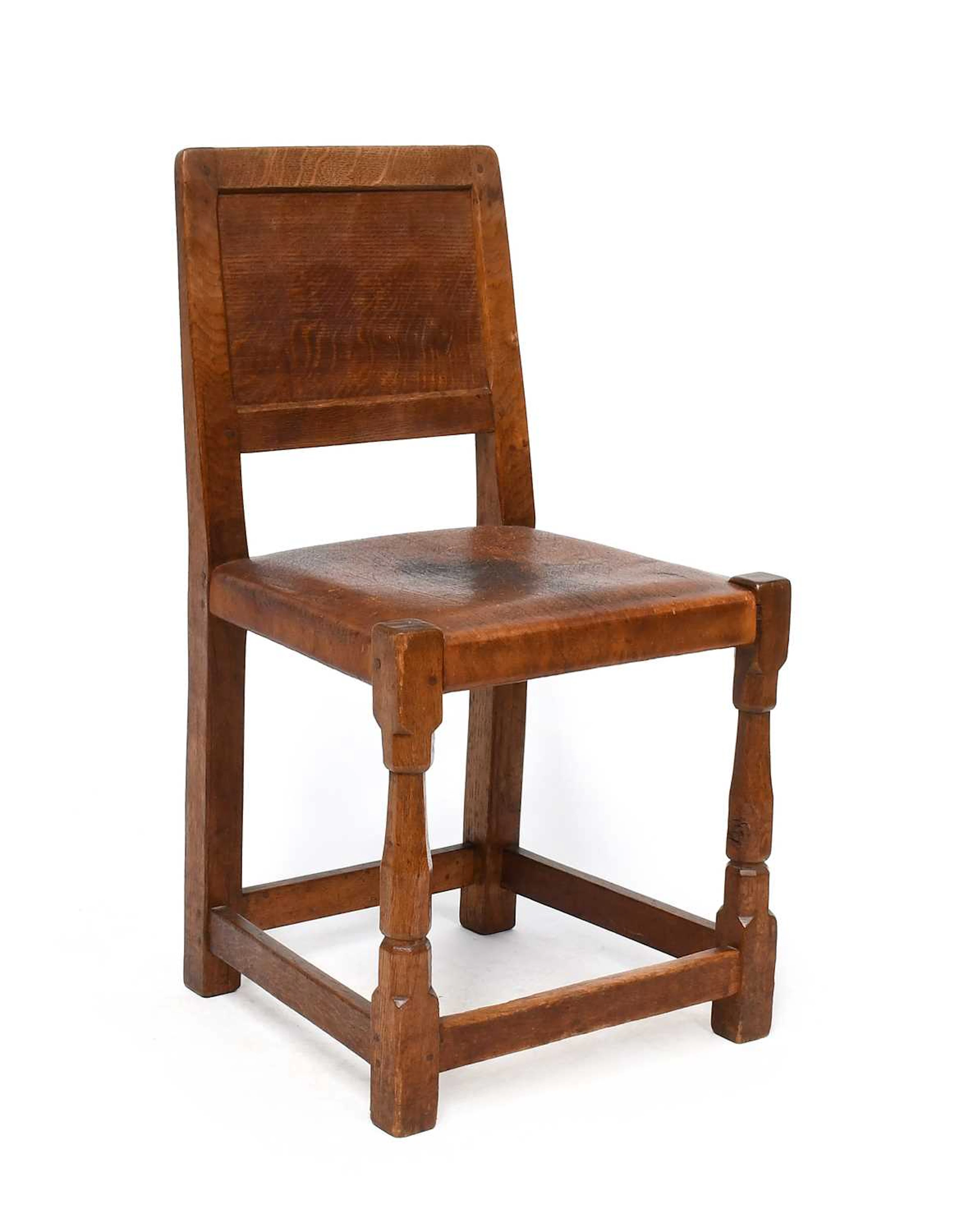 Robert Mouseman Thompson (1876-1955):, An English Oak Panel Back Dining Chair