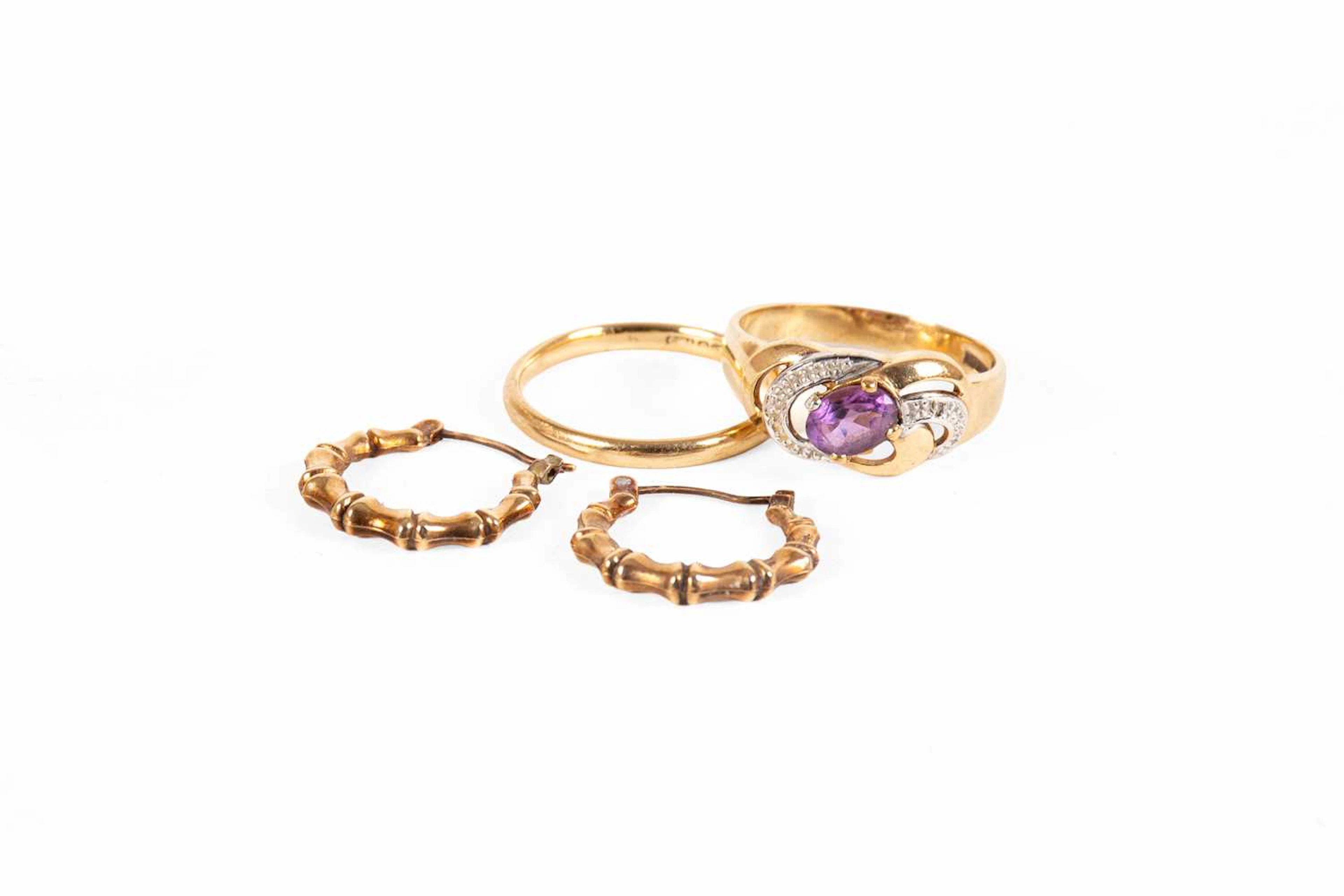 A 9 Carat Gold Band Ring, A 9 Carat Gold Amethyst Ring, A Pair of Hoop Earrings