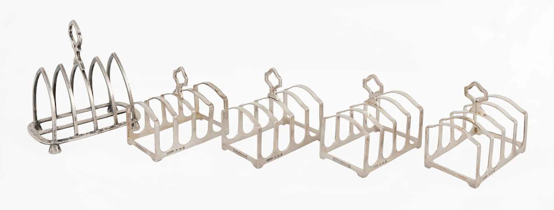 A Set of Four George V Silver Toast-Racks, by William Griffiths and