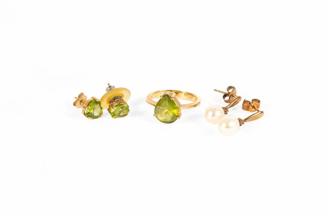 A Peridot Ring, A Pair of Peridot Earrings, A Pair of Cultured Pearl