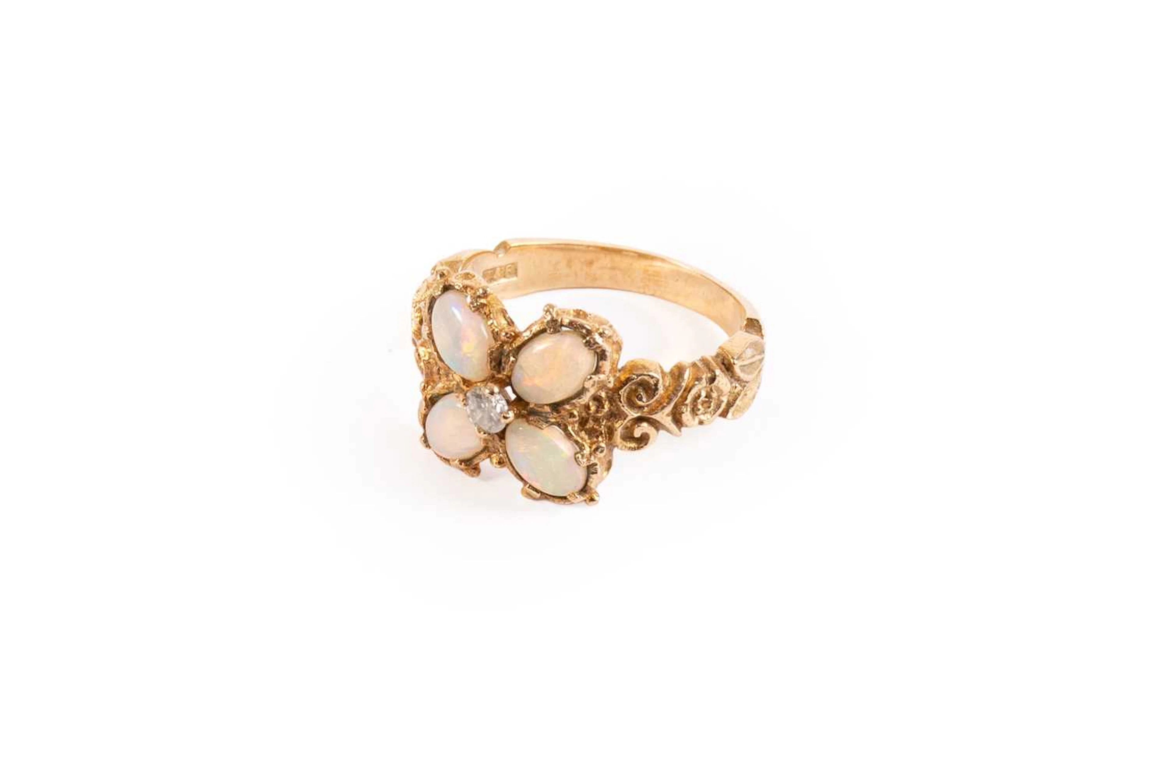 A 9 Carat Gold Opal and Diamond Cluster Ring