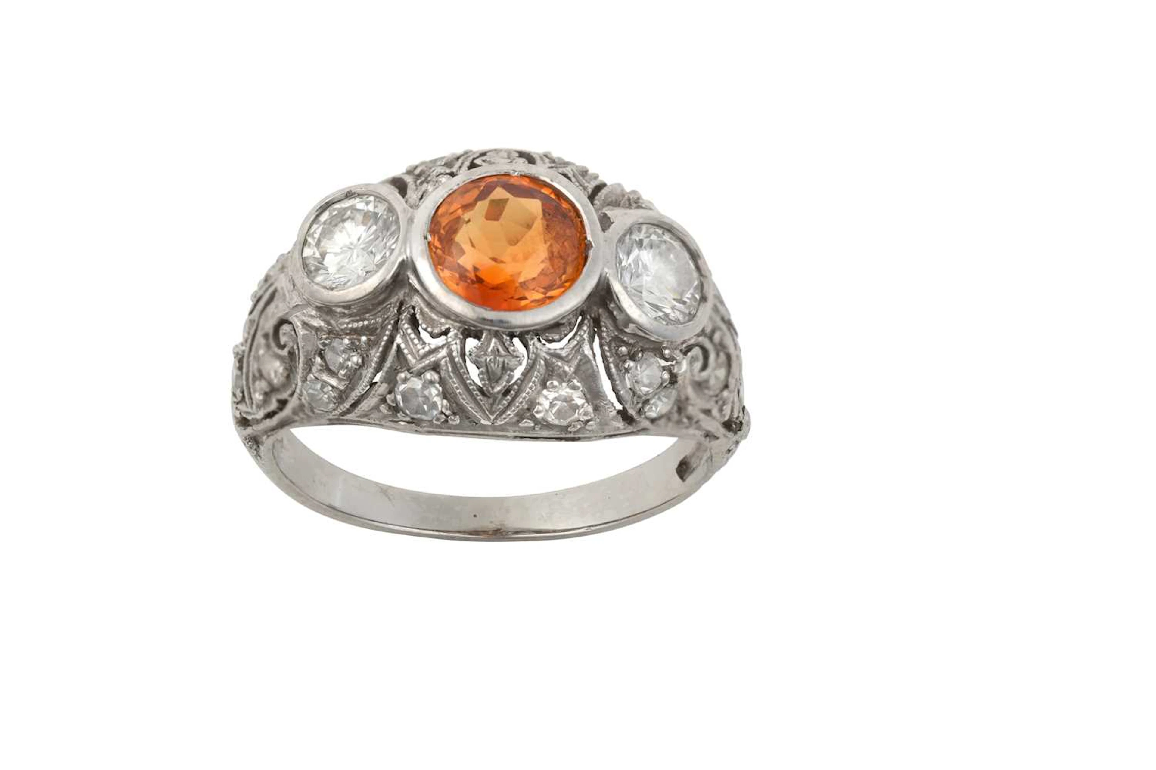 An Orange Sapphire and Diamond Ring
