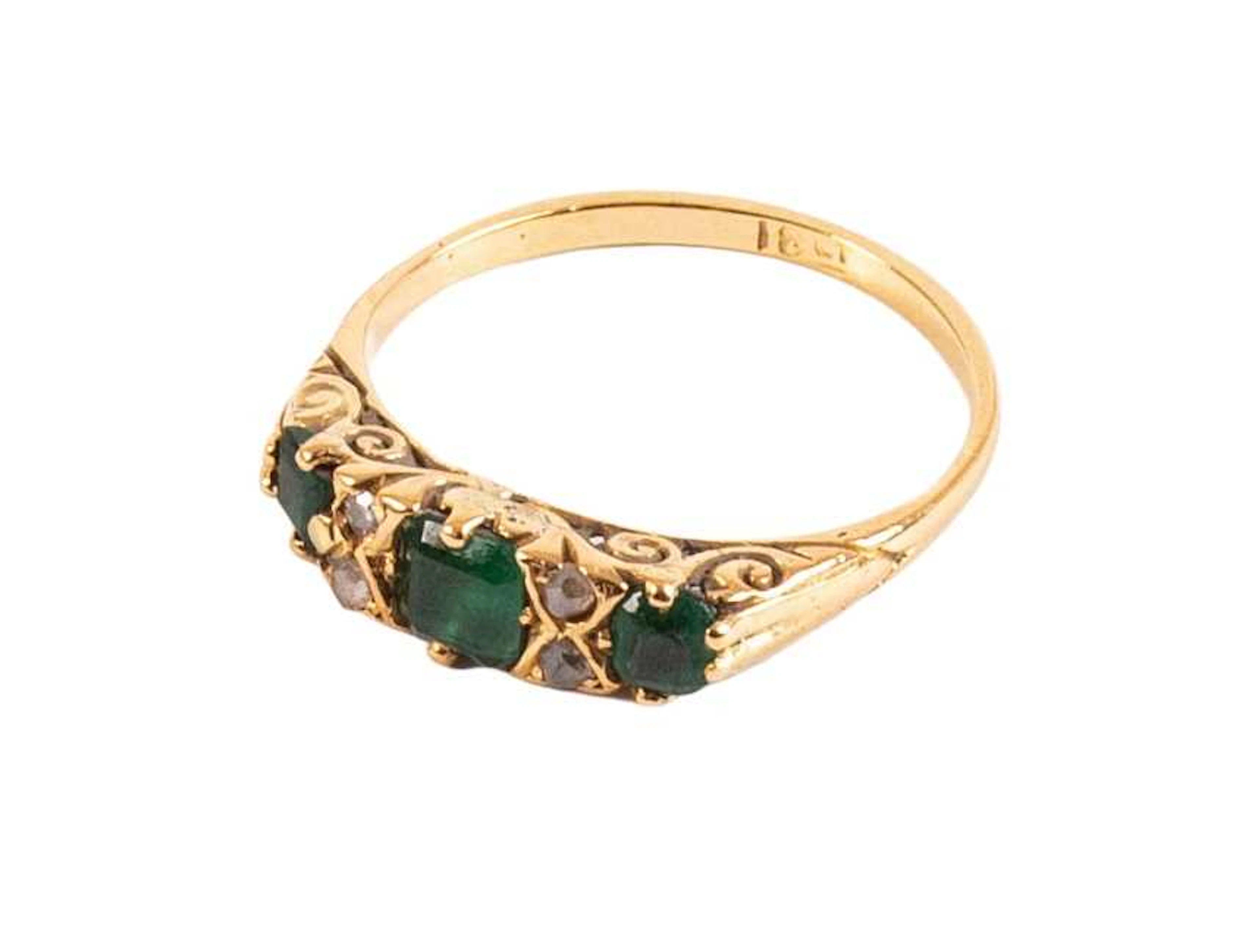 An Emerald and Diamond Ring