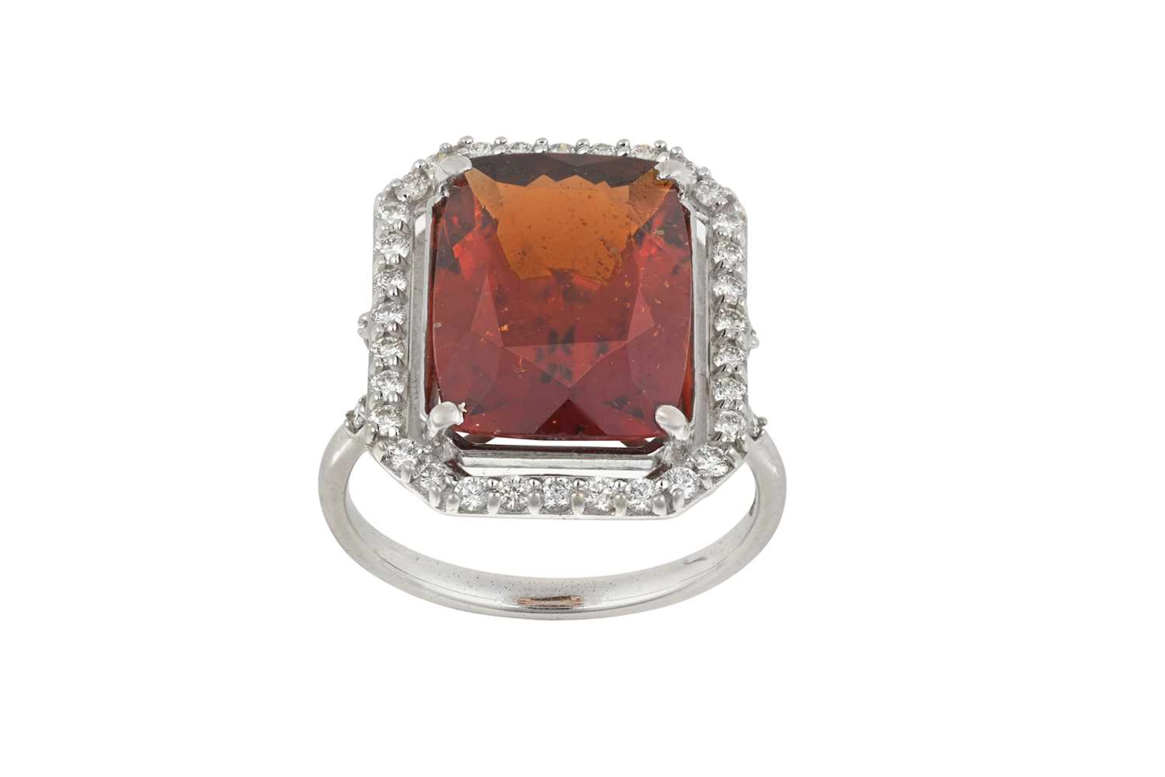 An 18 Carat White Gold Garnet and Diamond Cluster Ring