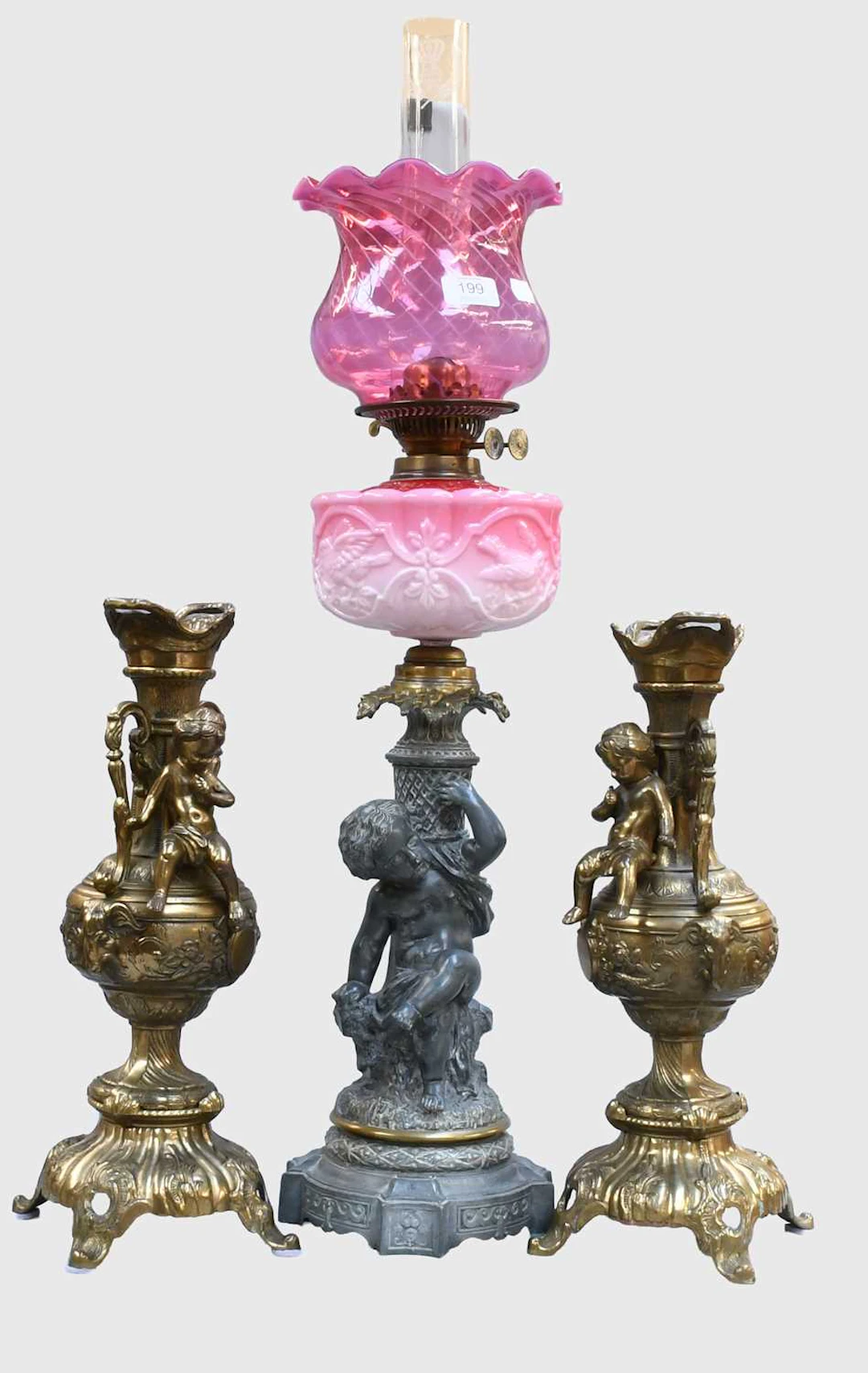 A Victorian Spelter and Brass Mounted Oil Lamp
