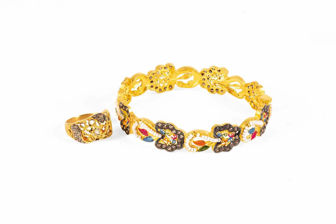 An Enamel, Bead and Cubic Zirconia Bangle, A Similar Ring