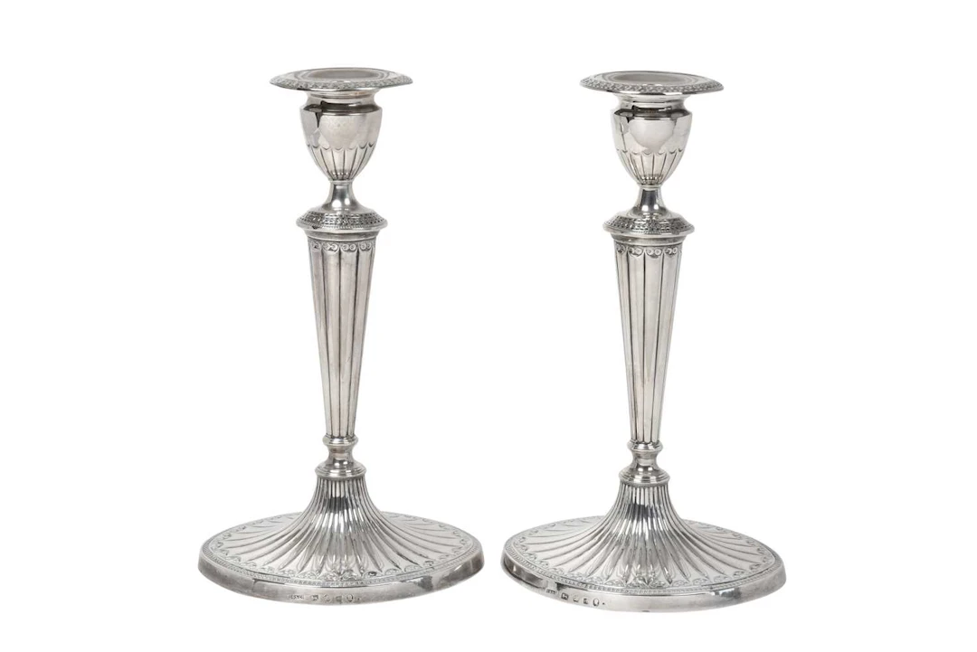 A Pair of George III Silver Candlesticks by John Green, Roberts, Mosley