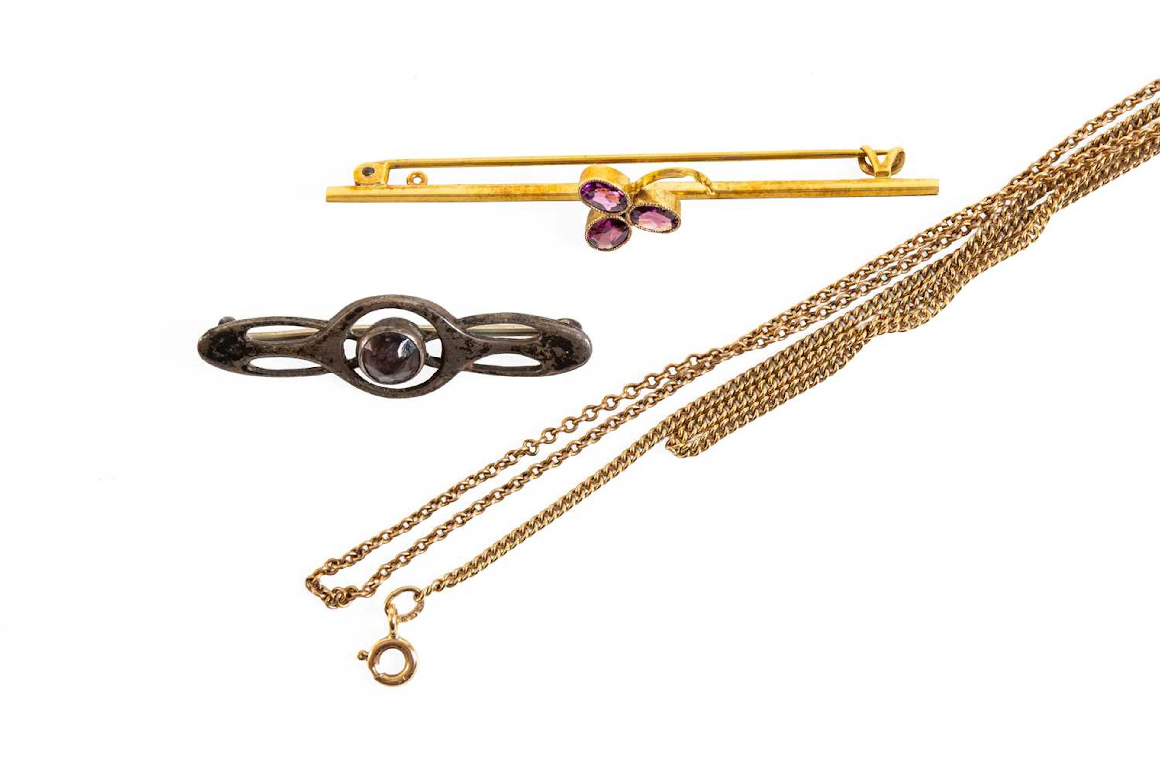 An Garnet Bar Brooch, A Purple Paste Brooch, A Curb Link Chain, Another Chain