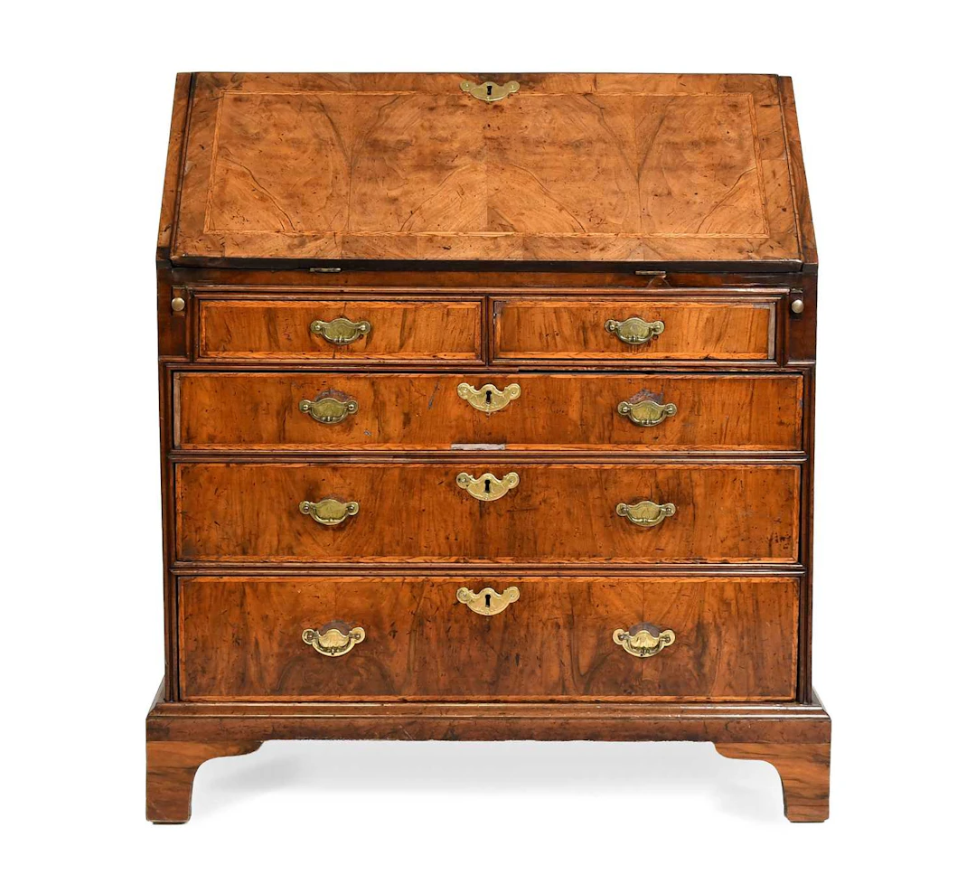 A George I Walnut, Crossbanded, Featherbanded and Pine Sided Bureau