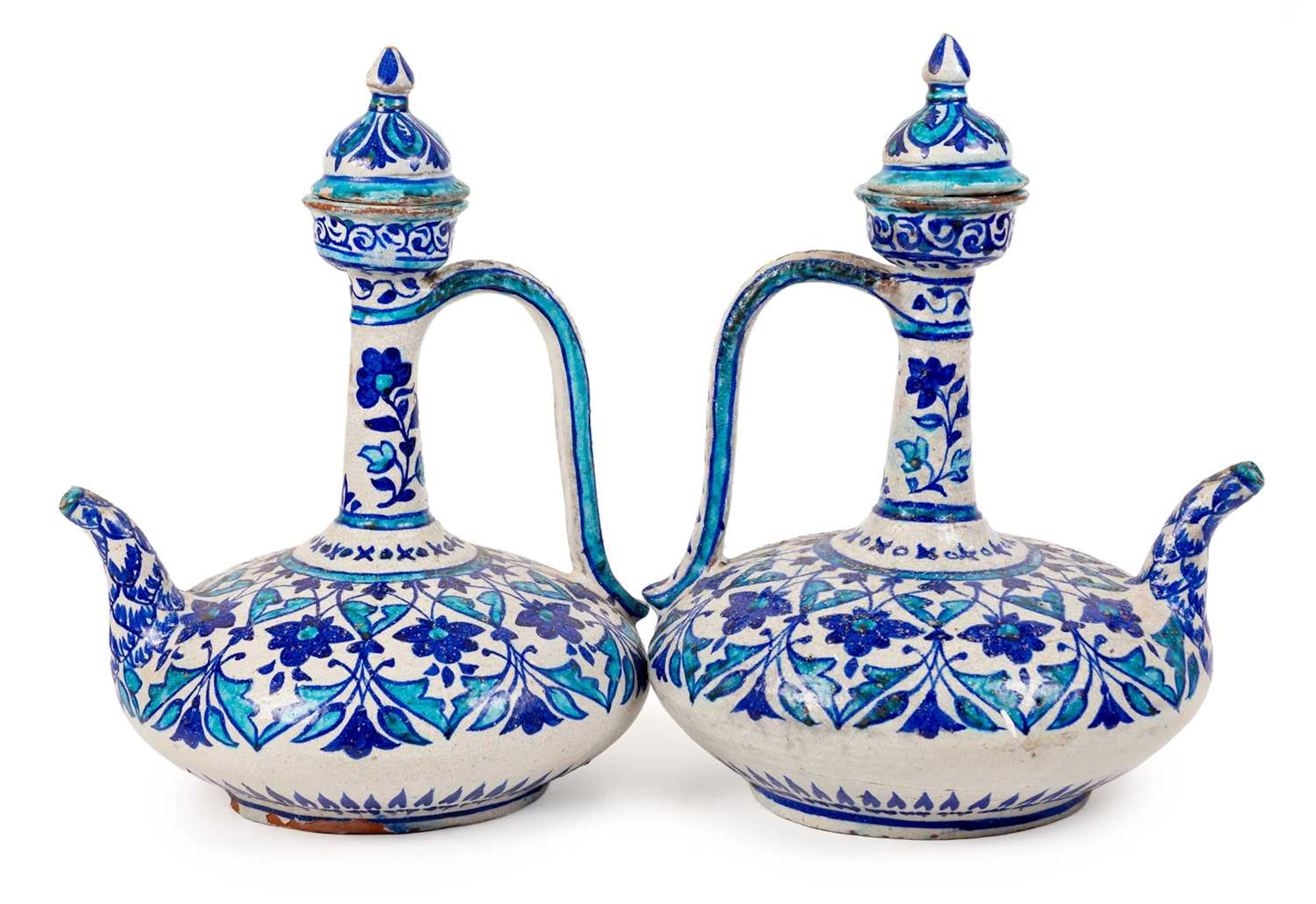A Pair of Bombay School of Art Faience Ewers and Covers, late 19th century