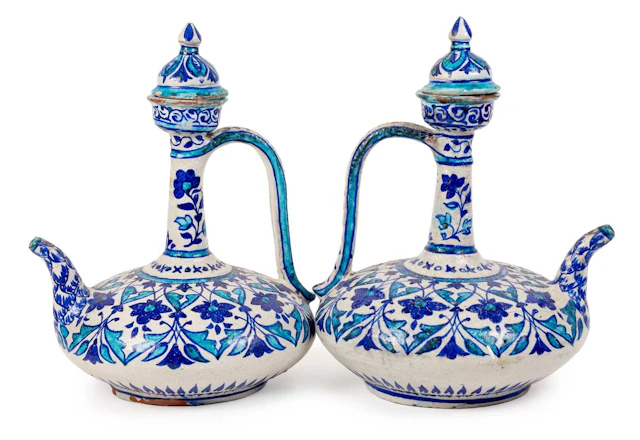 A Pair of Bombay School of Art Faience Ewers and Covers, late 19th century