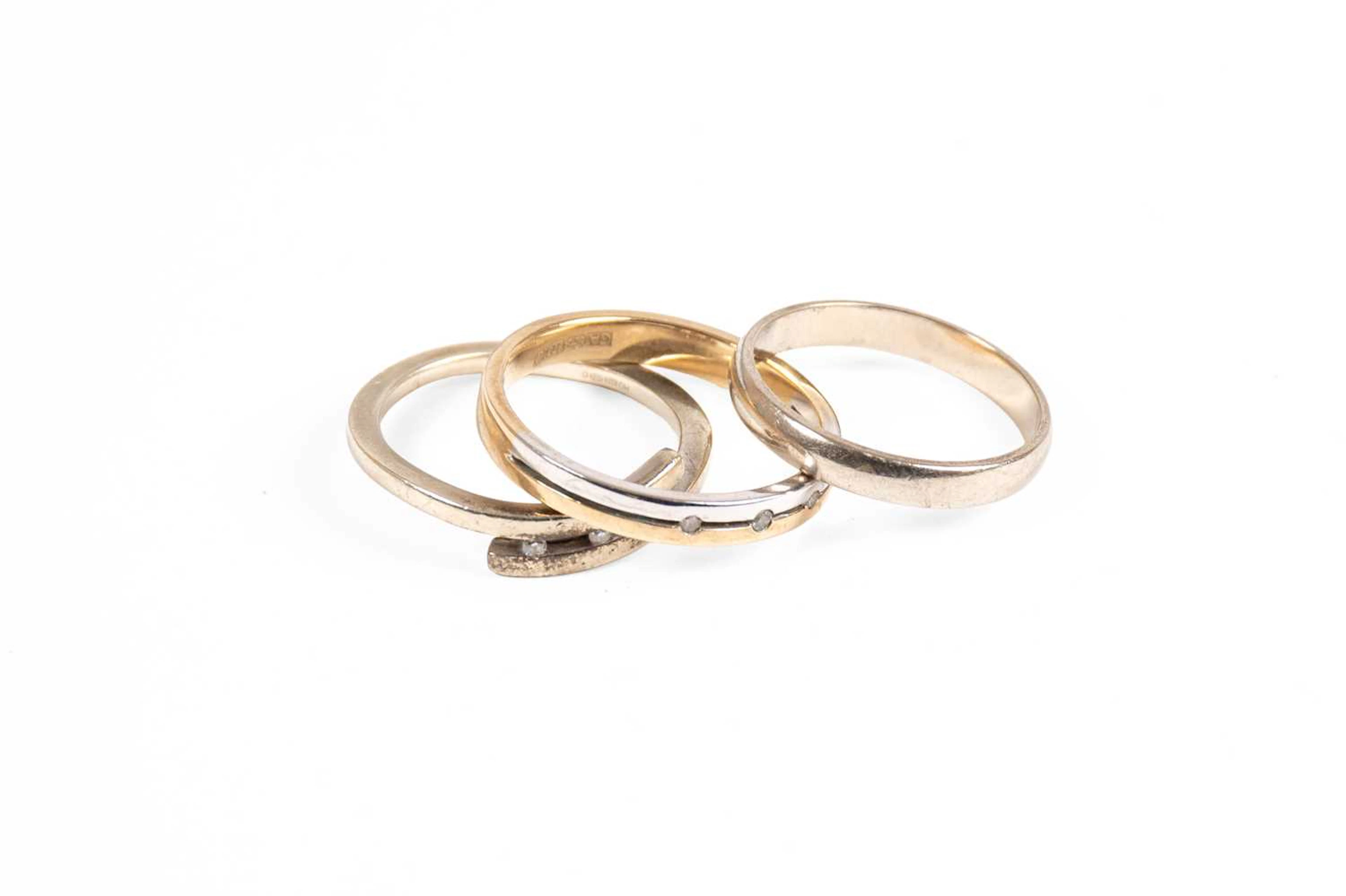 A 9 Carat White Gold Band Ring, A 9 Carat White Gold and Diamond Crossover