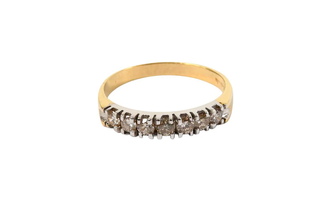 An 18 Carat Gold Diamond Half Hoop Ring