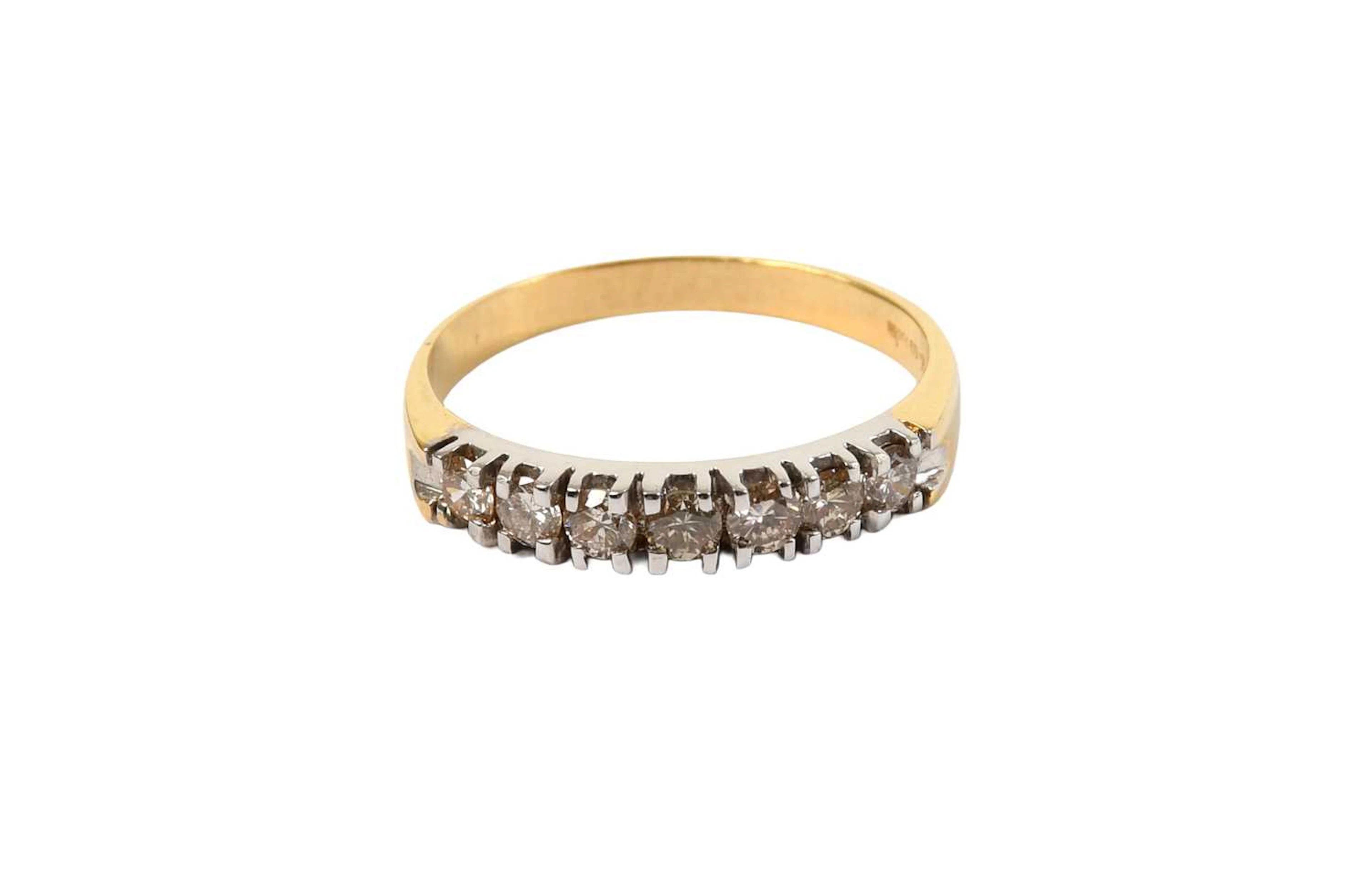 An 18 Carat Gold Diamond Half Hoop Ring