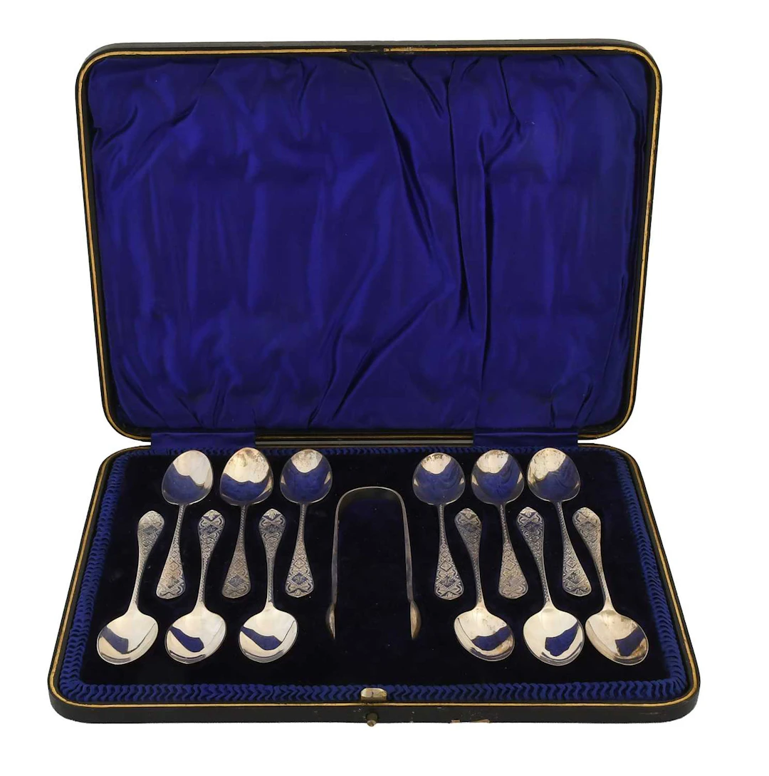 A Cased Set of Twelve Victorian Silver Teaspoons and a Pair of Sugar-Tongs