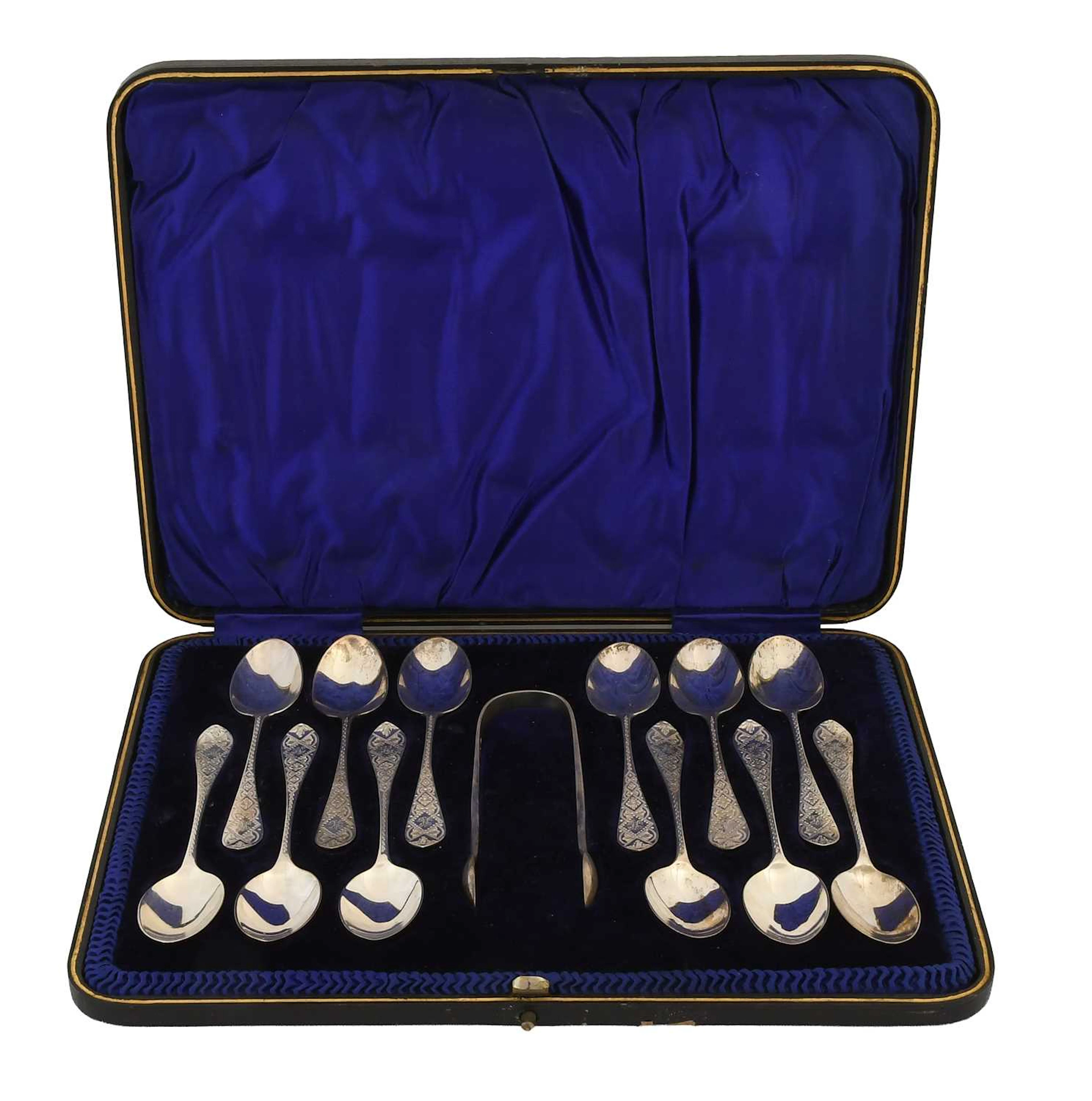 A Cased Set of Twelve Victorian Silver Teaspoons and a Pair of Sugar-Tongs