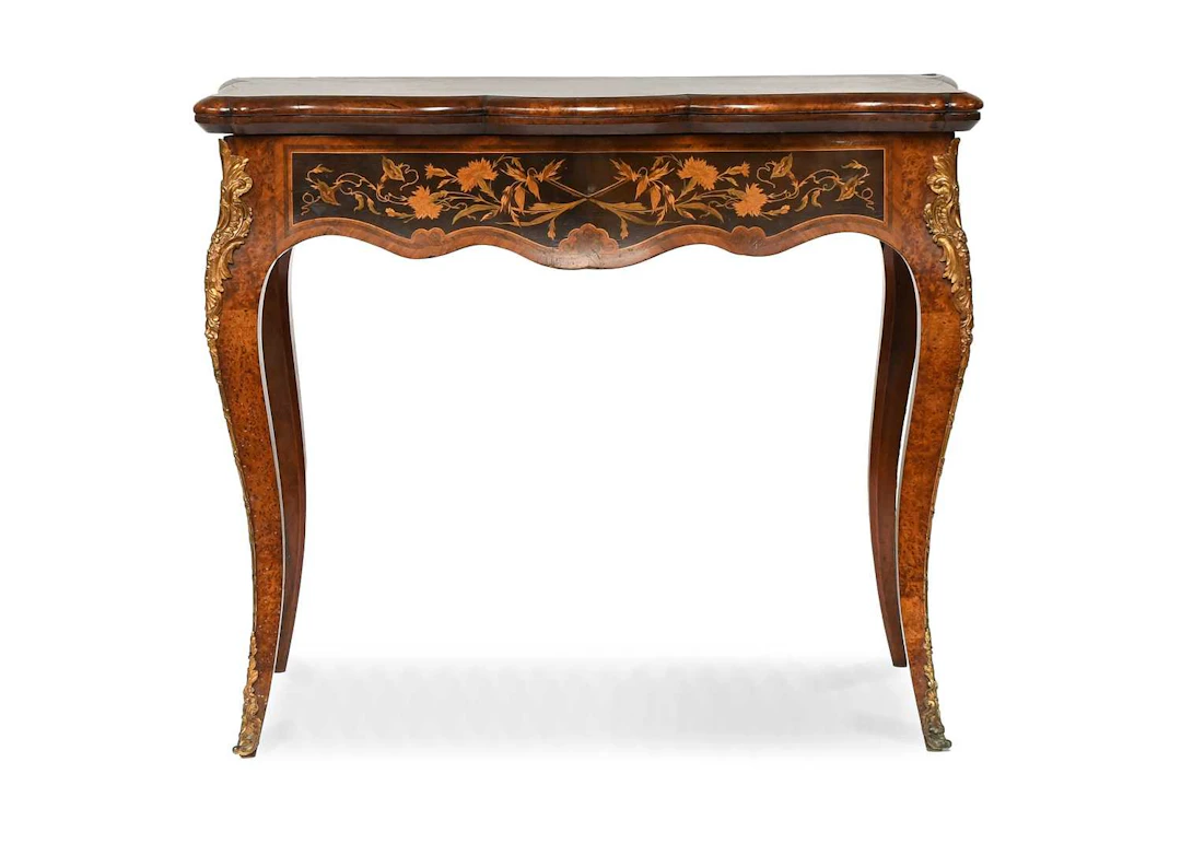 A Victorian Amboyna, Walnut, Rosewood and Marquetry-Inlaid Card Table