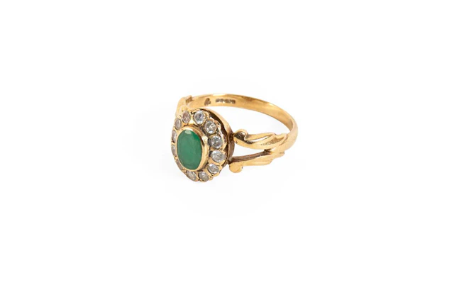 A 9 Carat Gold Green Stone Cluster Ring