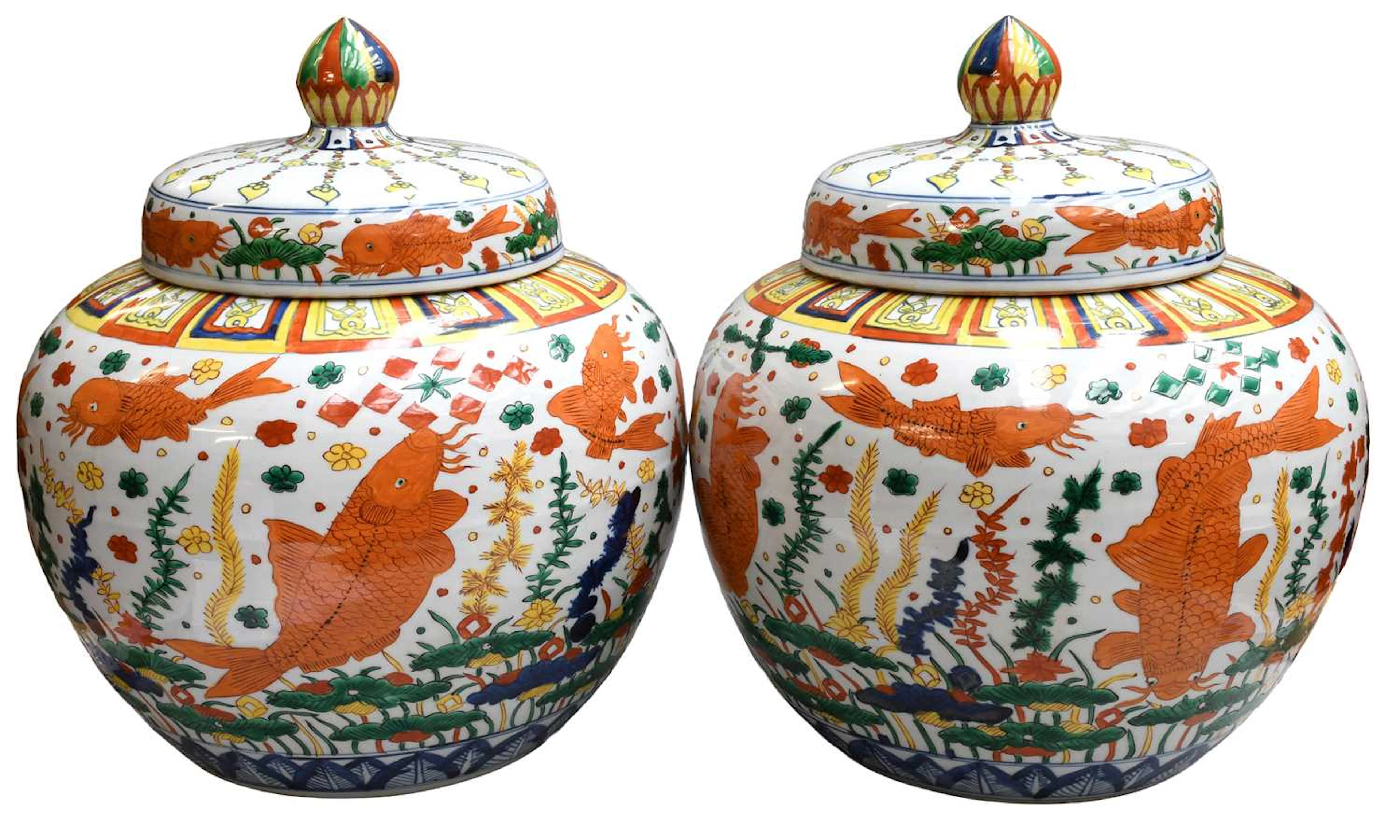A Pair of Chinese Porcelain Wucai Jars and Covers