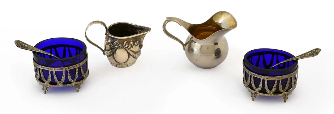 A Pair of German Silver Salt-Cellars and Spoons, Together With