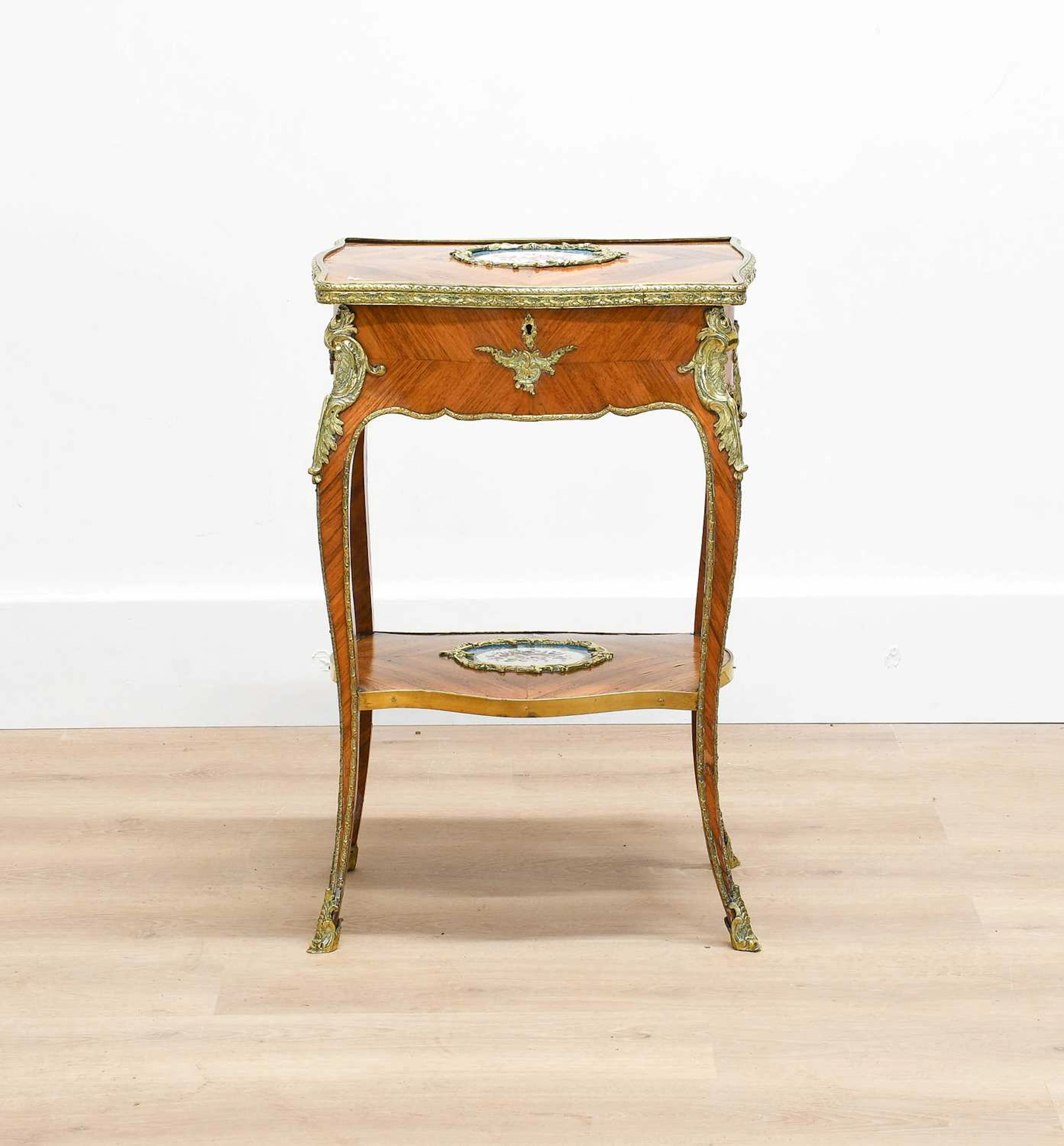 A French Kingwood, Gilt-Metal-Mounted and Porcelain-Inset Table a