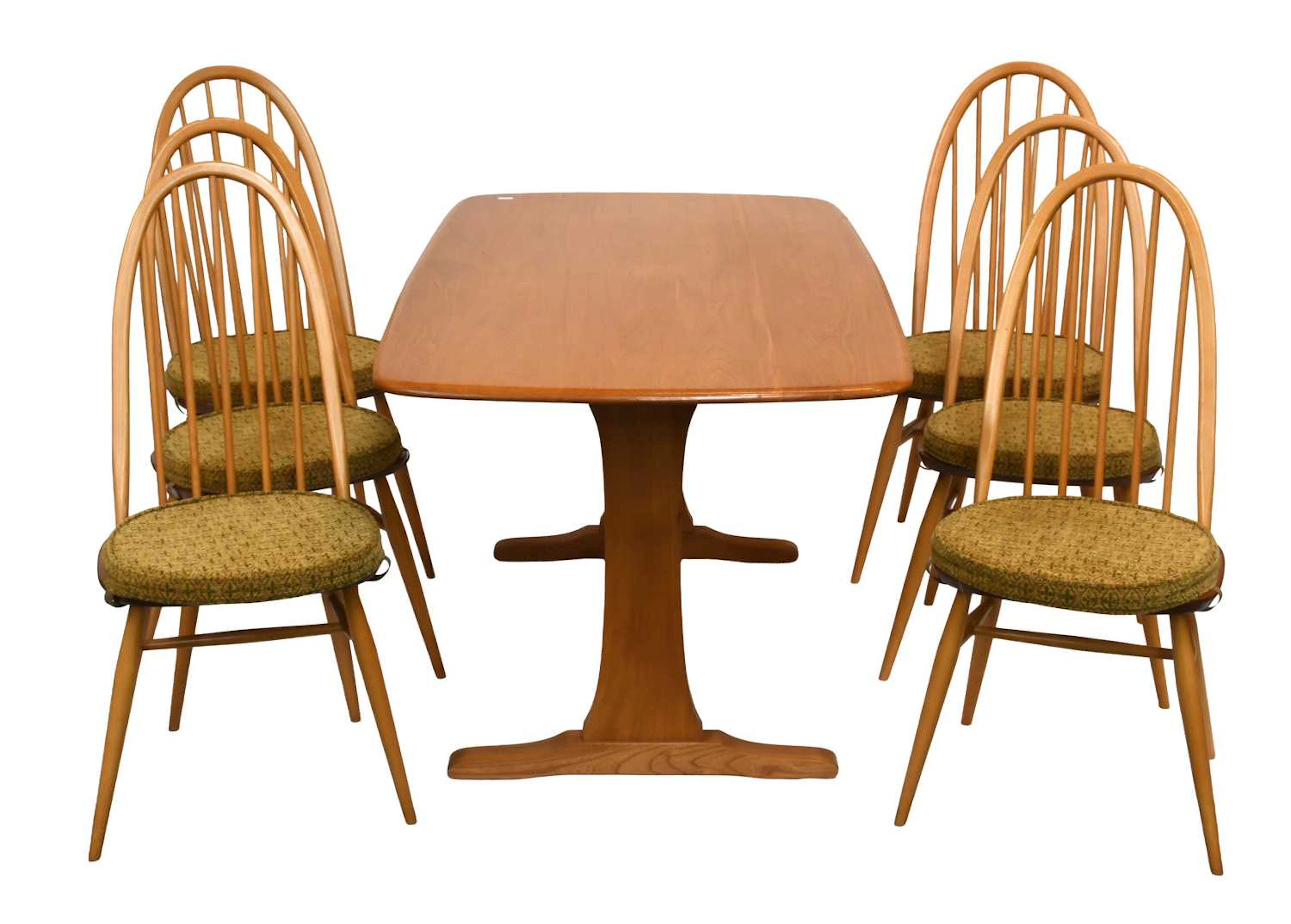 An Ercol Light Elm Dining Table and Set of Six Matching Chairs