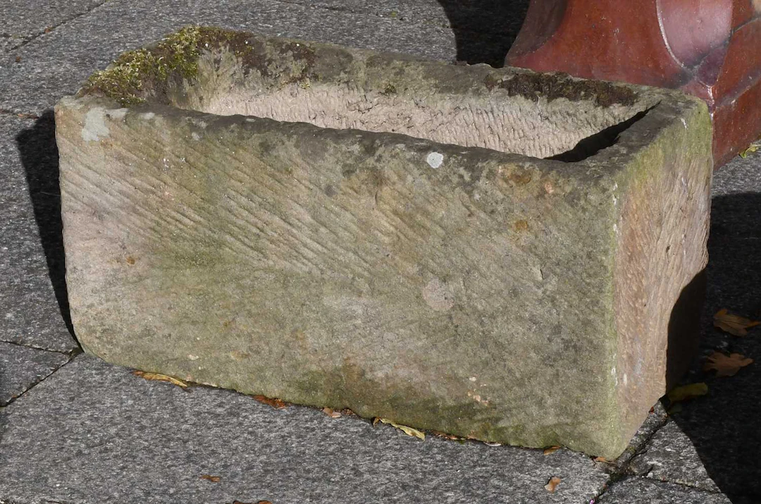 A Small Rectangular Weathered Stone Trough