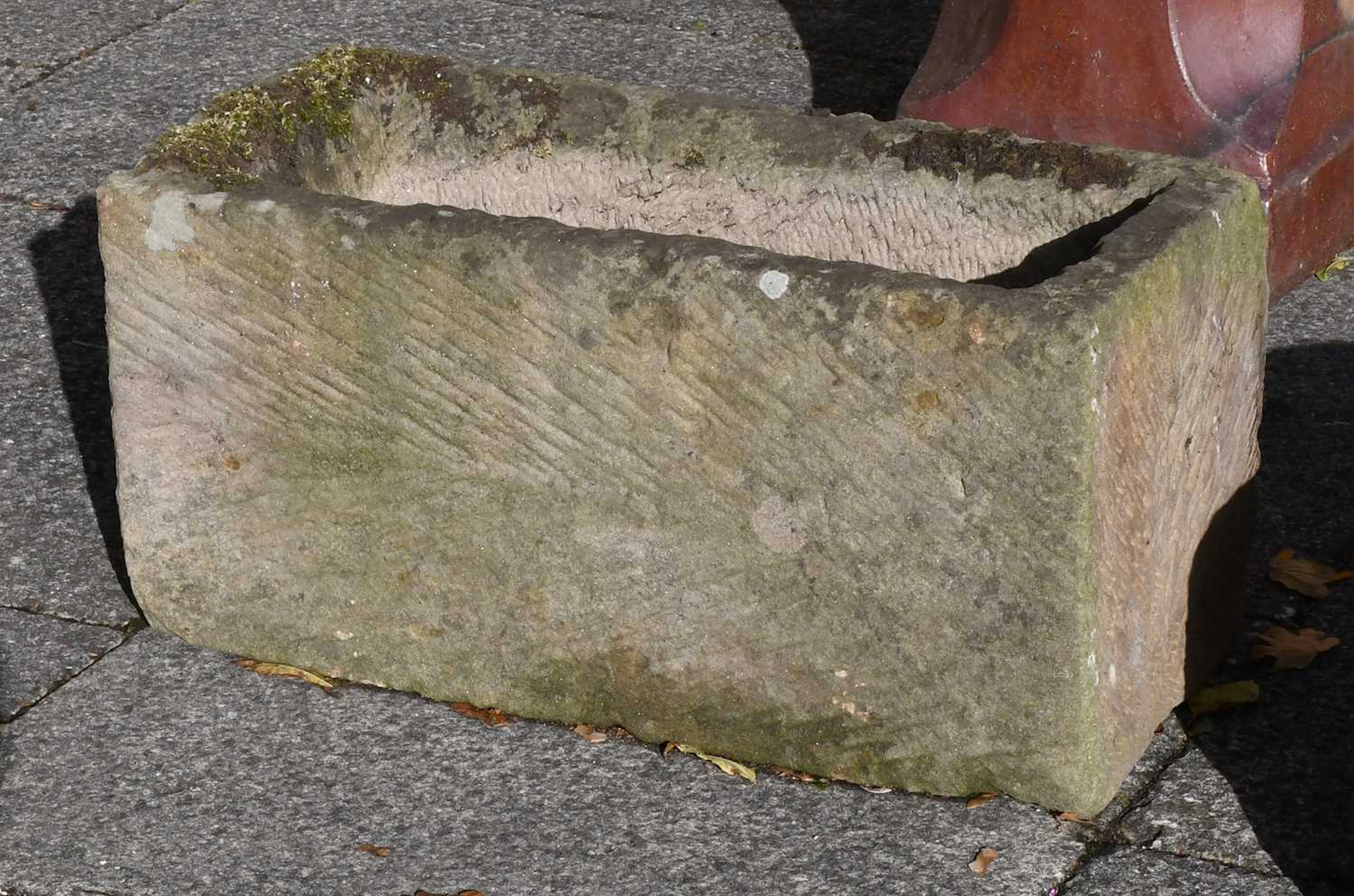 A Small Rectangular Weathered Stone Trough