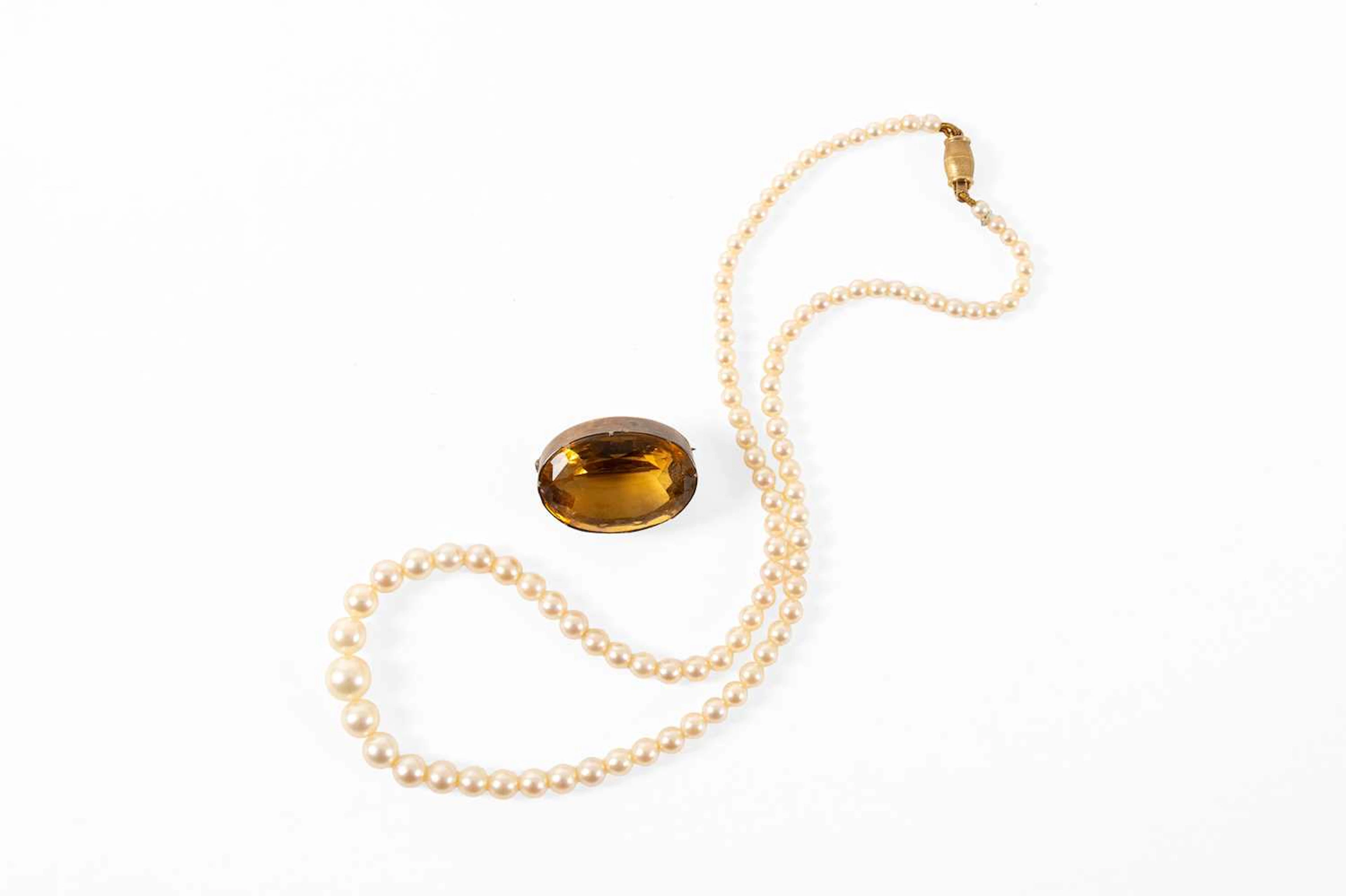A String of Graduated Cultured Pearls, A Citrine Brooch