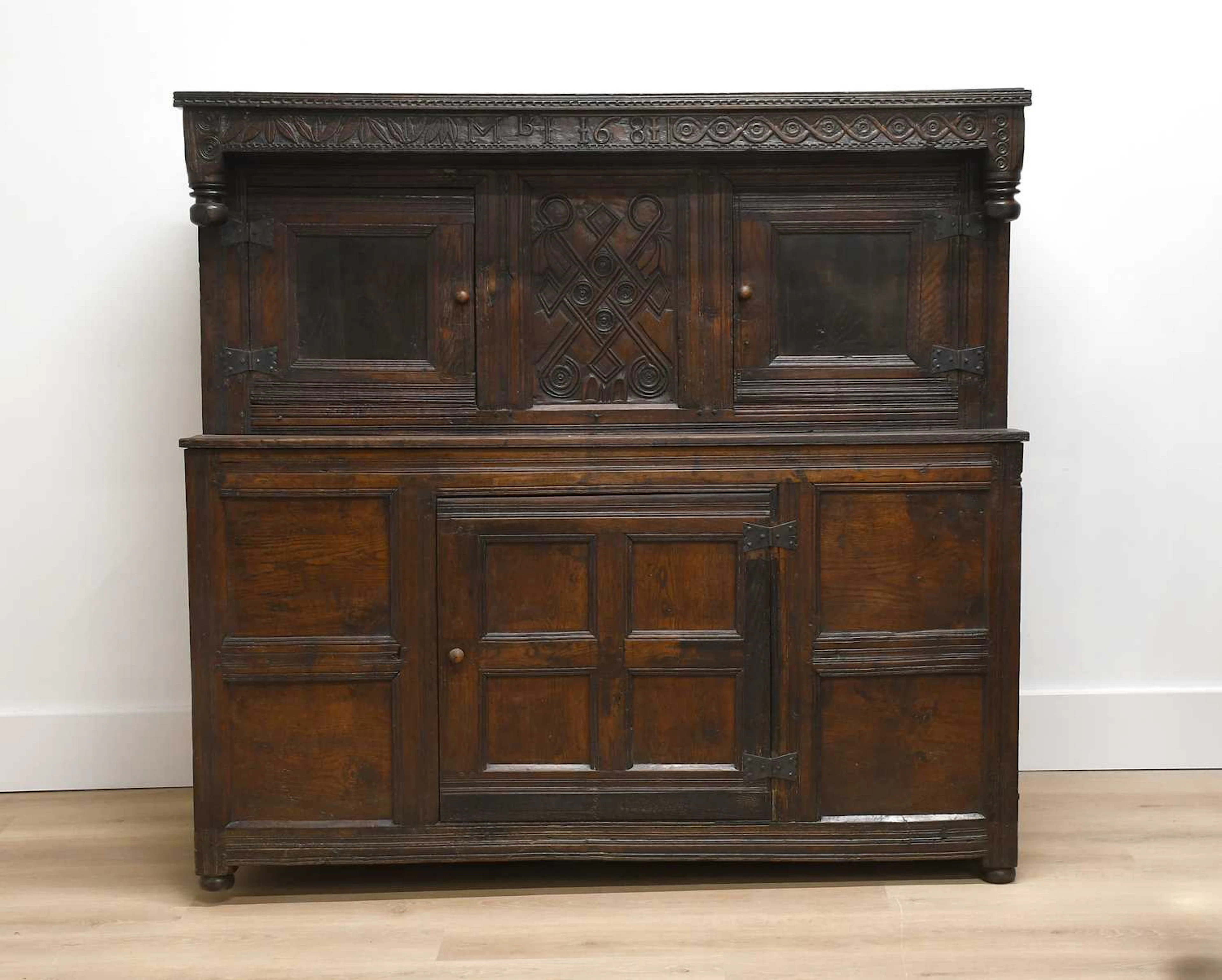 A Charles II Joined Oak Court Cupboard, dated 1681 and initialled MBI