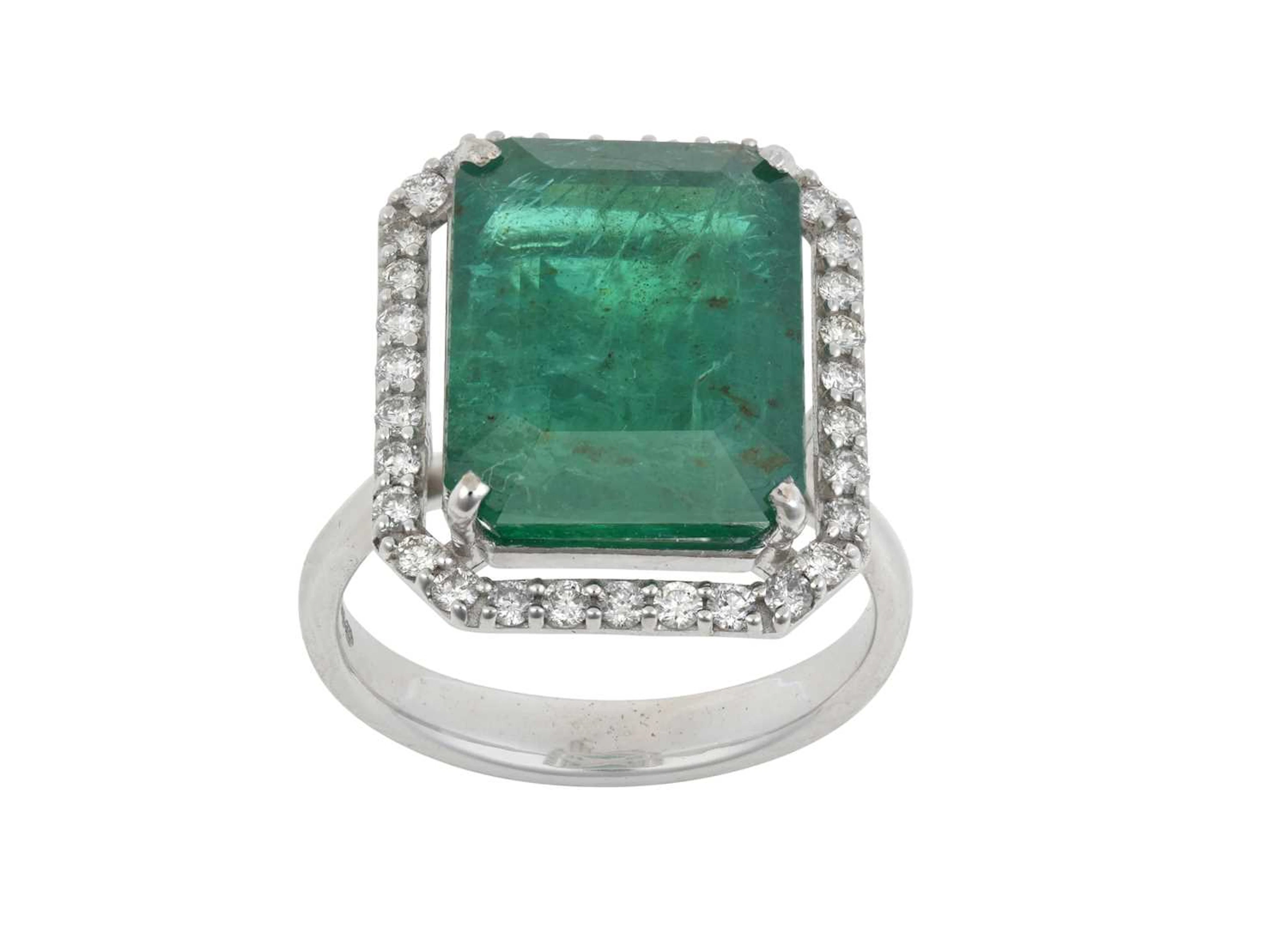 An 18 Carat White Gold Emerald and Diamond Cluster Ring