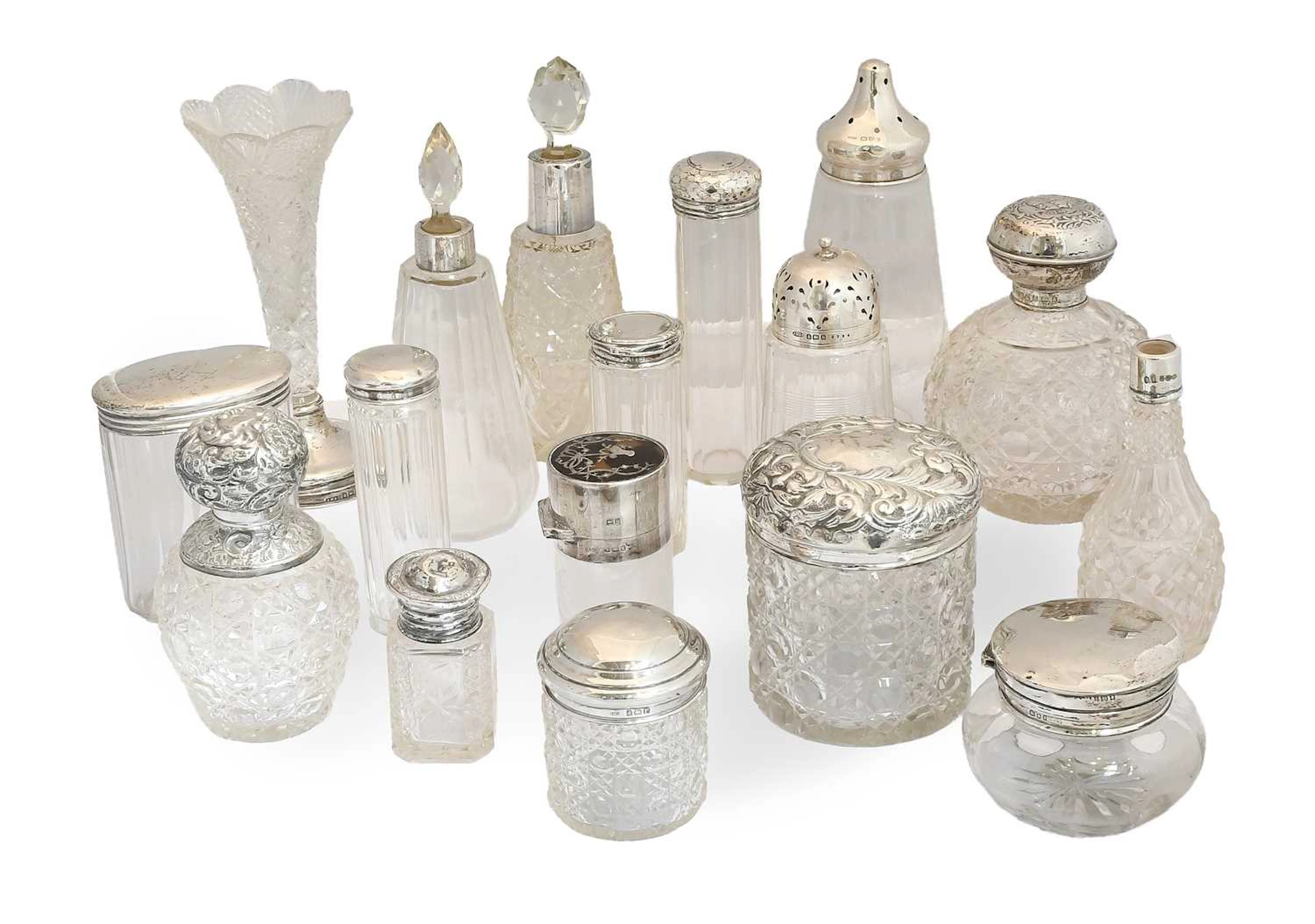 A Collection of Assorted Silver-Mounted Glass Scent-Bottles, Together With