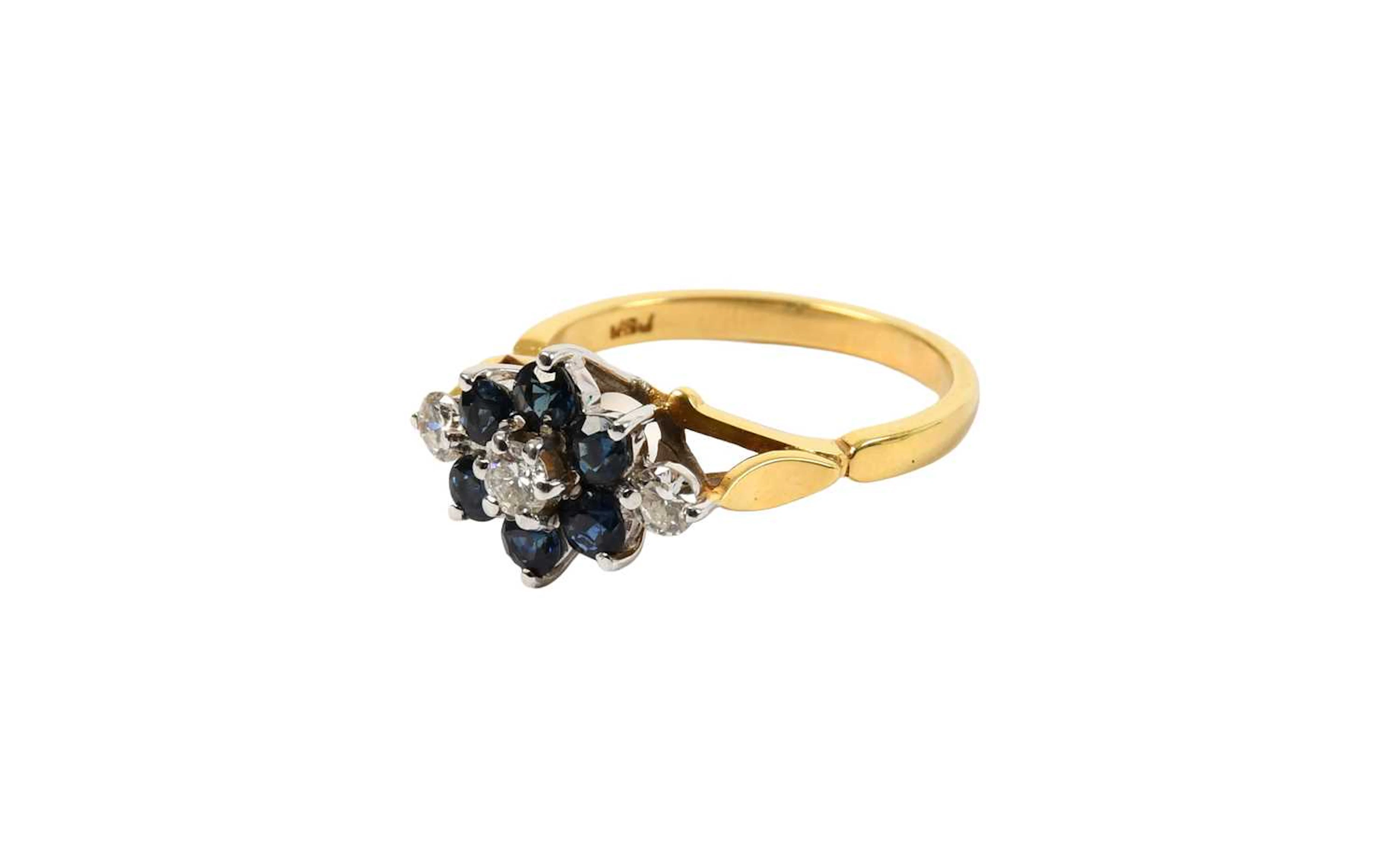 An 18 Carat Gold Sapphire and Diamond Cluster Ring