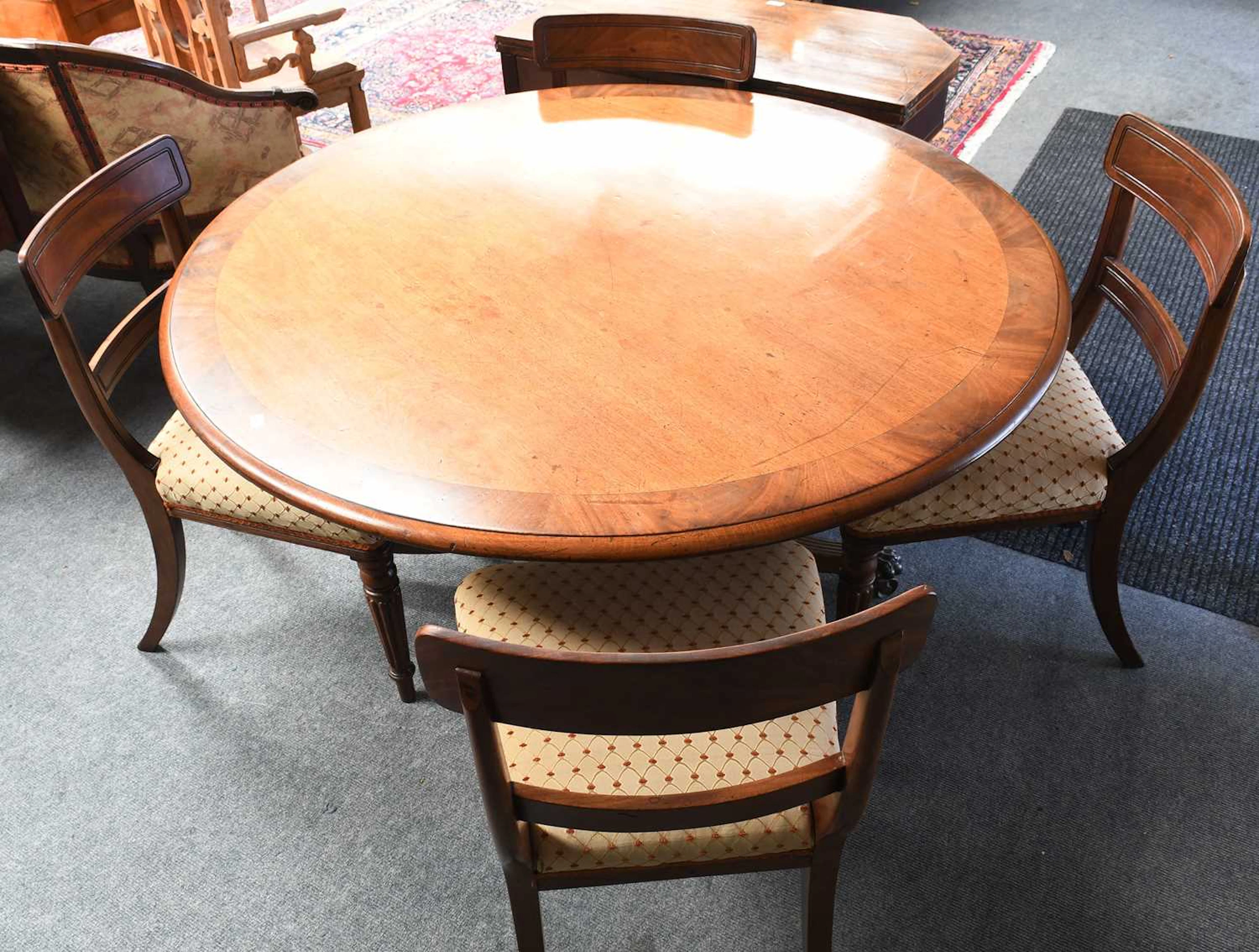 A Crossbanded Mahogany Circular Tilt-Top Breakfast table, 19th Century