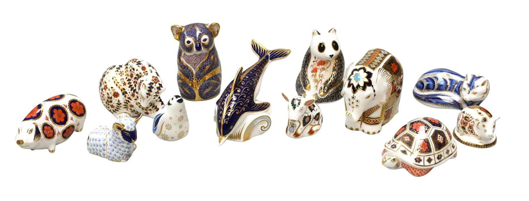 A Collection of Royal Crown Derby Porcelain Paperweights