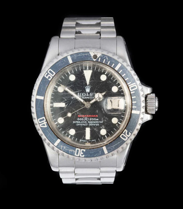 Rolex: A Single Red Line Submariner Automatic Calendar Centre Seconds